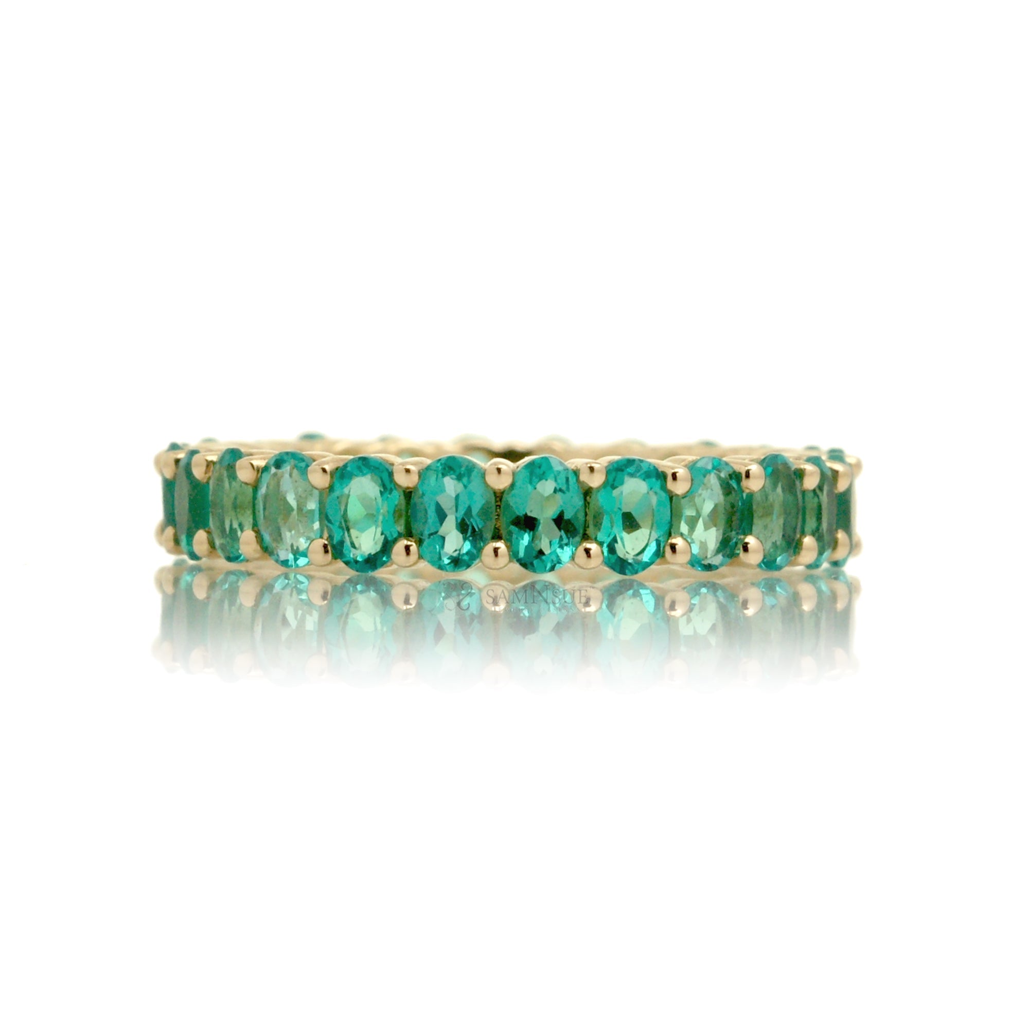 Emerald oval cut eternity band yellow gold