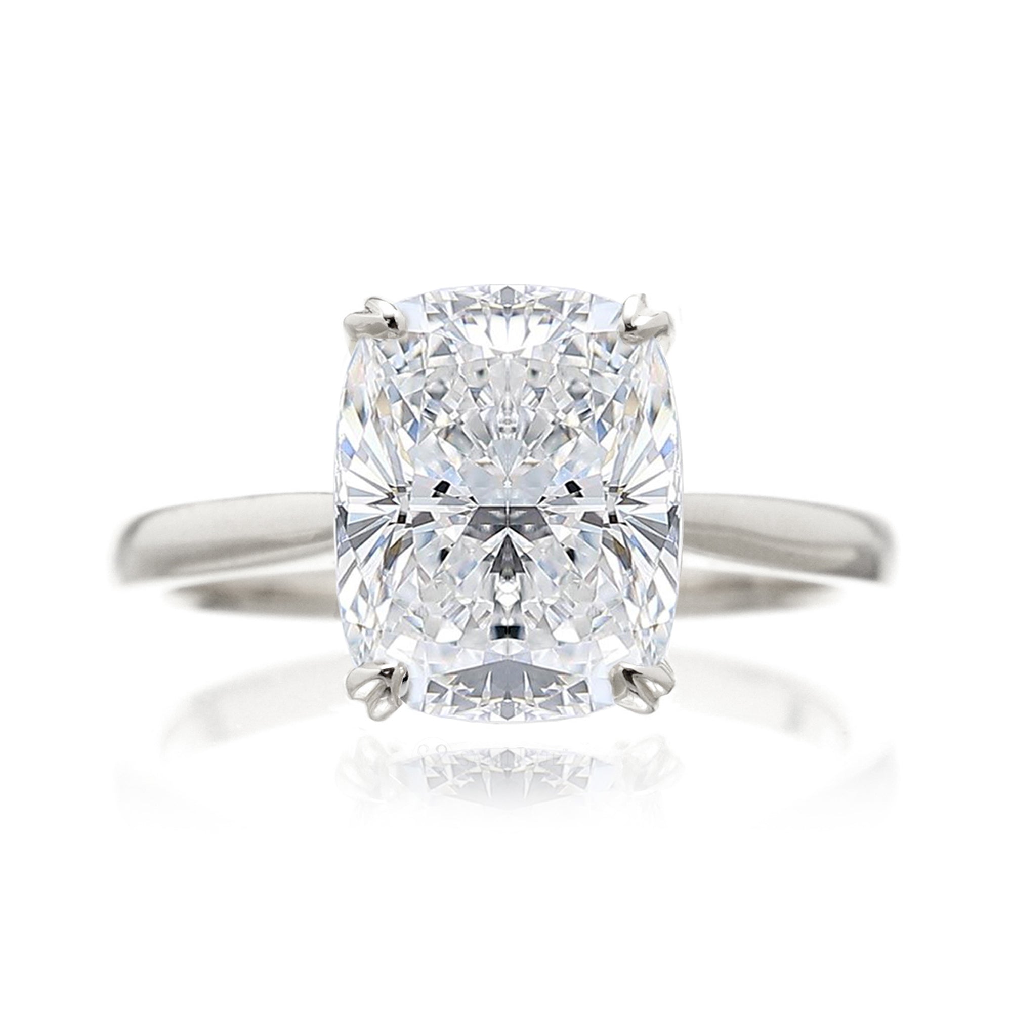 Cushion diamond solitaire engagement ring with solid band in white gold