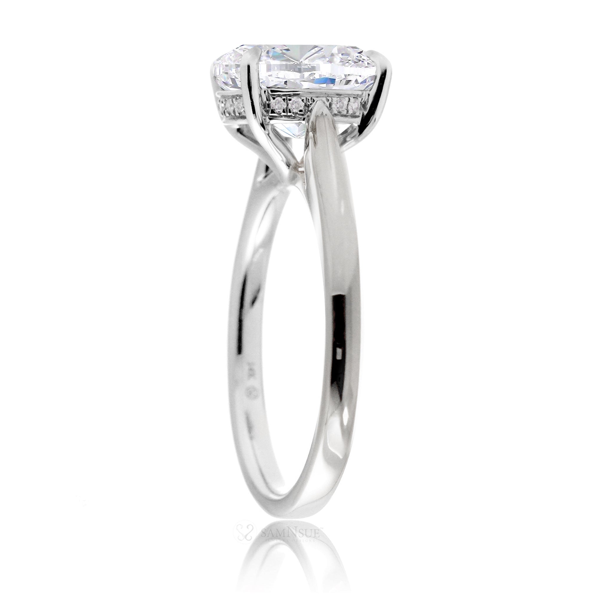 Solitaire moissanite engagement ring with a solid band and hidden halo - the Emily in white gold
