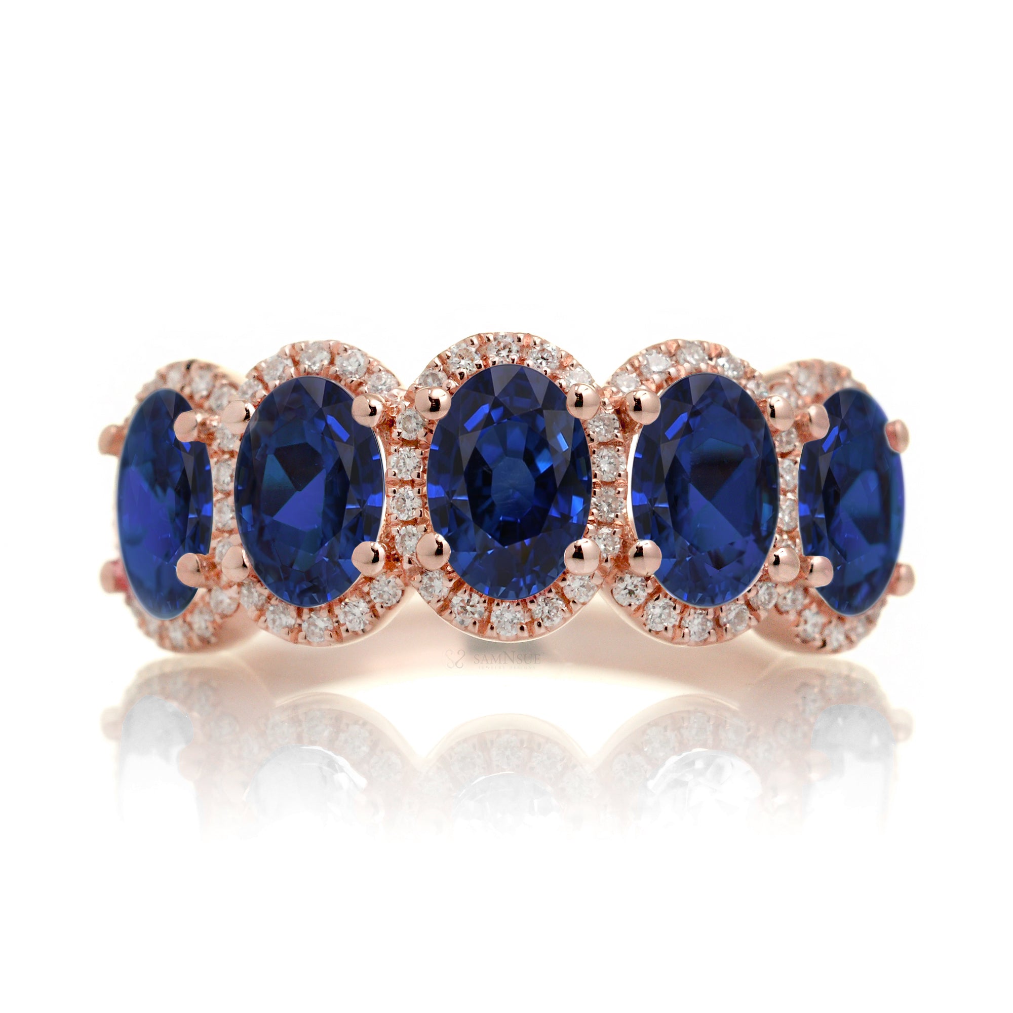 Five stone anniversary band with blue oval sapphire and diamond halo rose gold wedding band