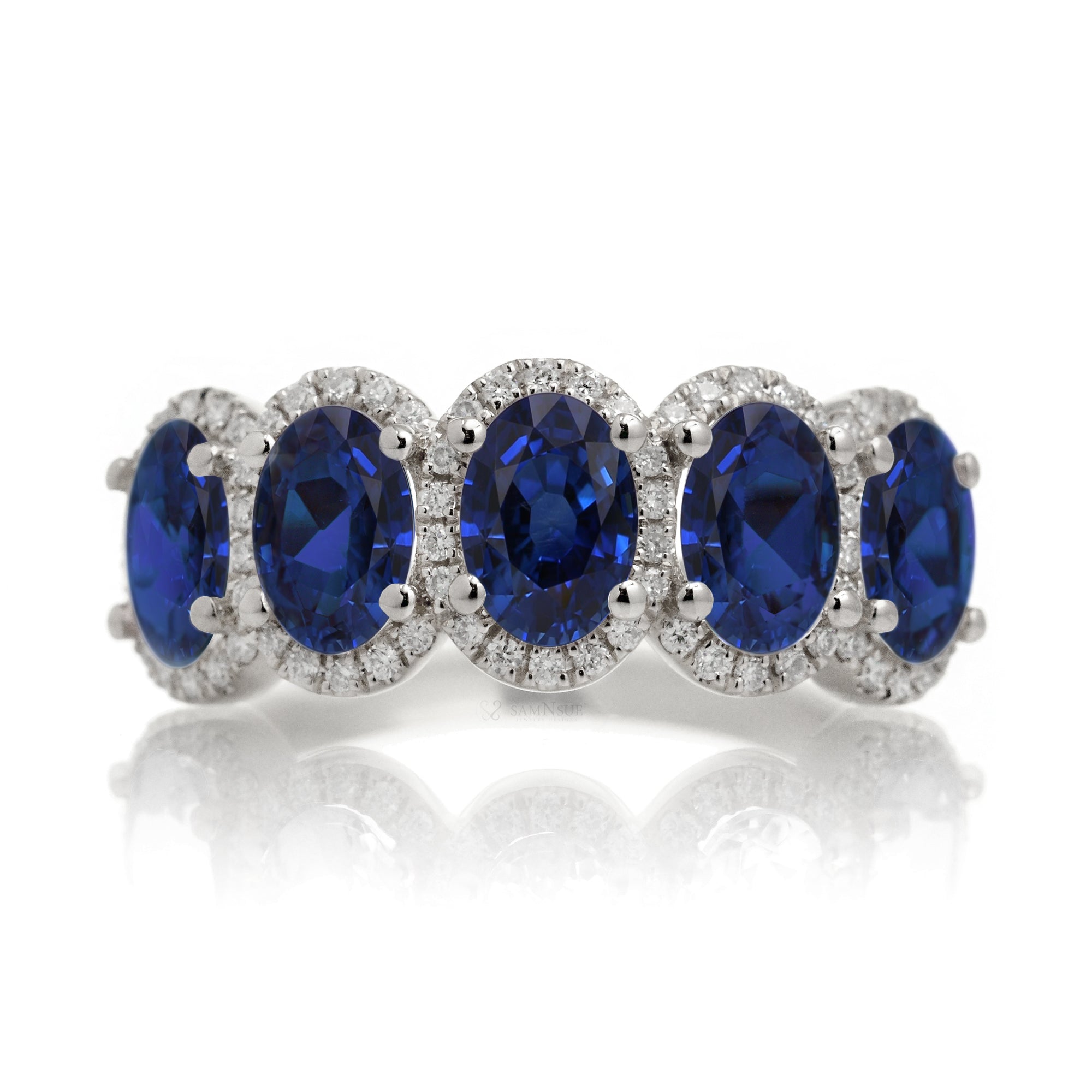 Five stone anniversary band with blue oval sapphire and diamond halo white gold wedding band