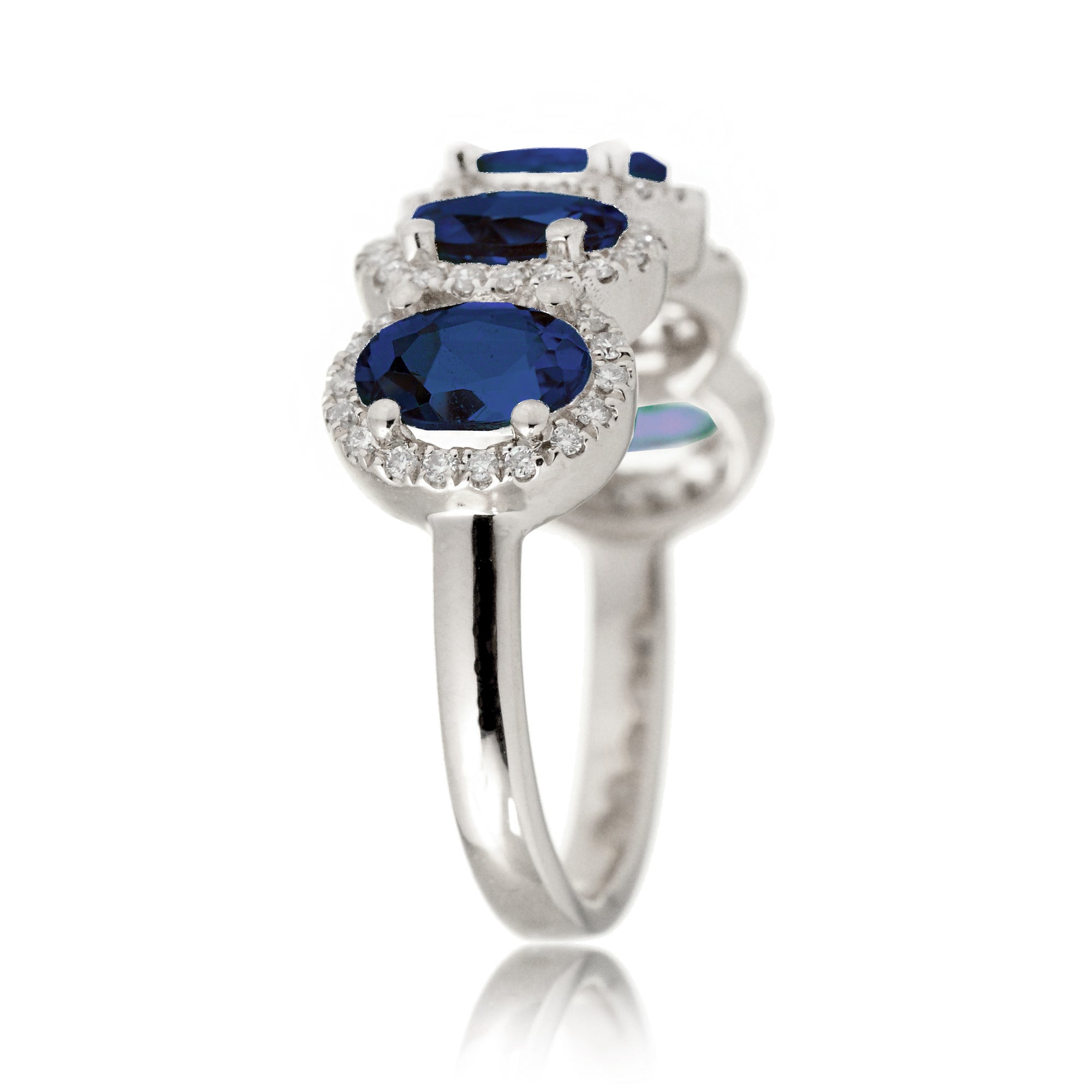 Five stone anniversary band with blue oval sapphire and diamond halo white gold wedding band