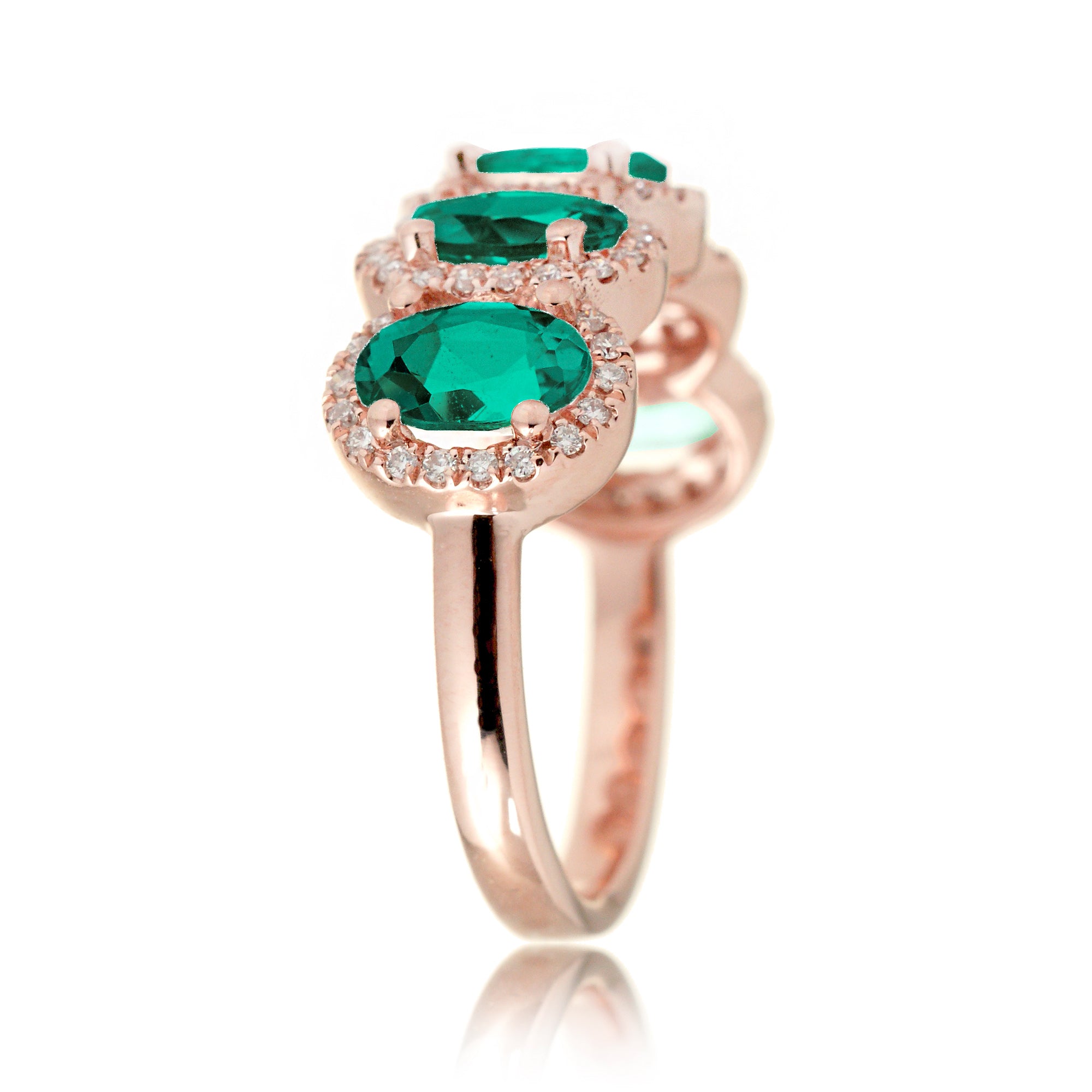 Anniversary band five stone oval emeralds with diamond halo in rose gold