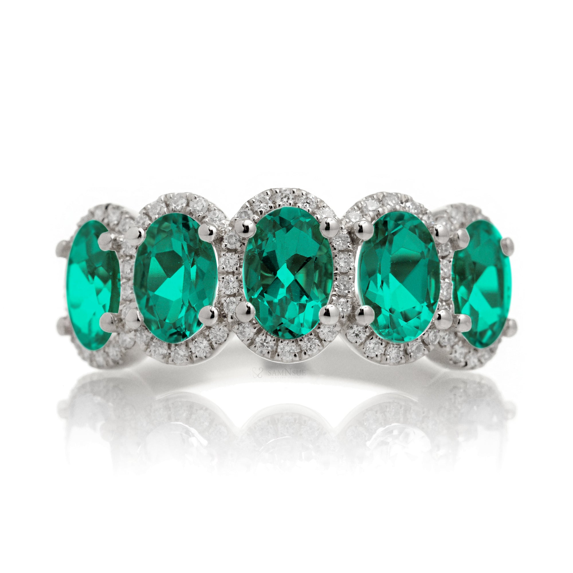 Anniversary band five stone oval emeralds with diamond halo in white gold