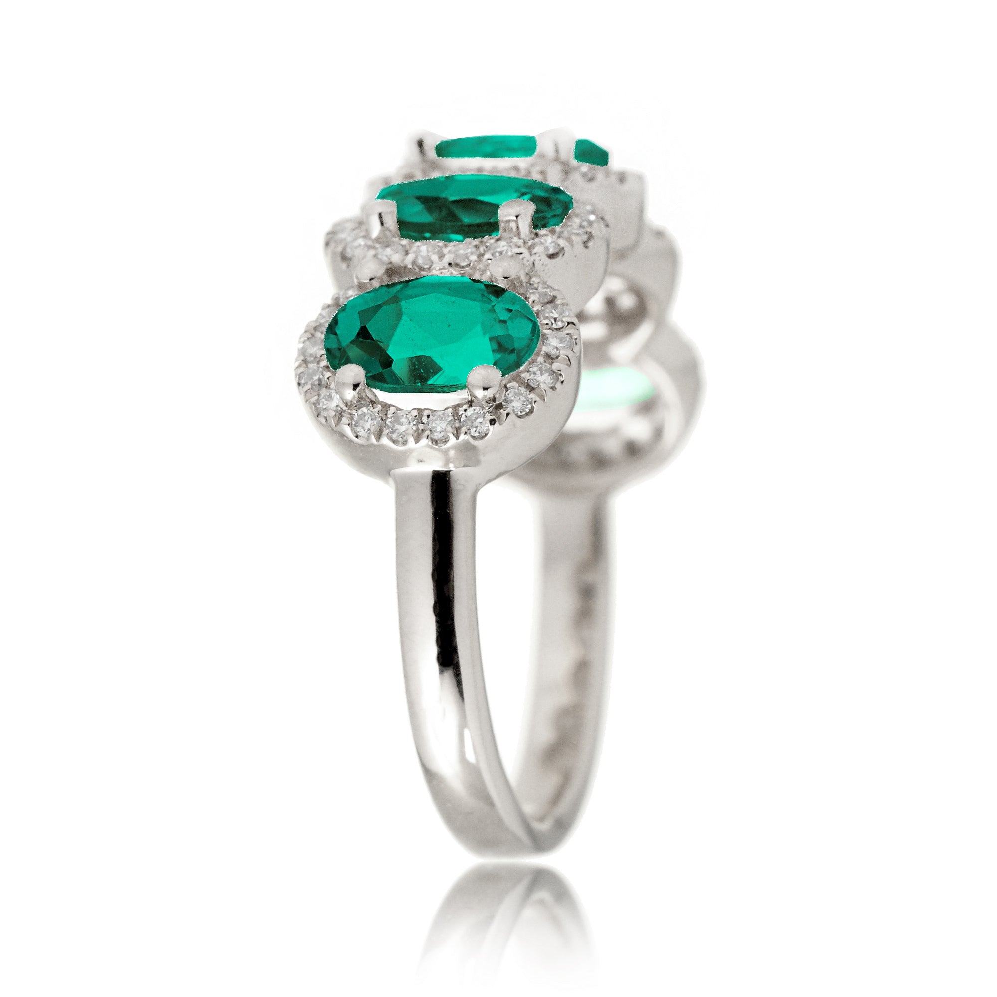 Anniversary band five stone oval emeralds with diamond halo in white gold