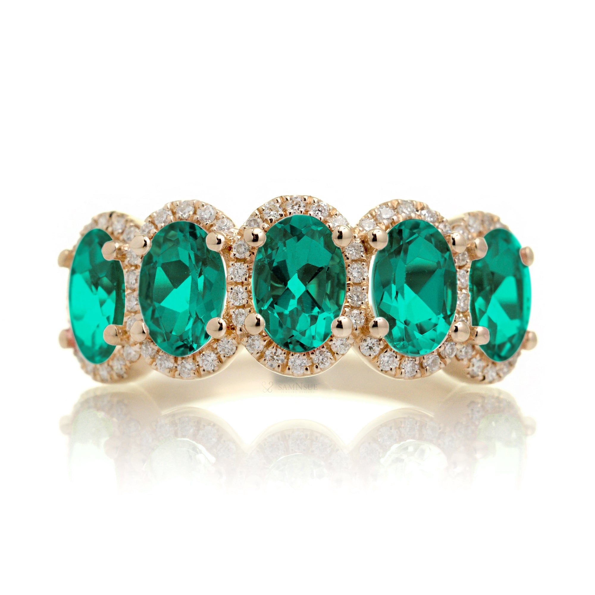 Anniversary band five stone oval emeralds with diamond halo in yellow gold