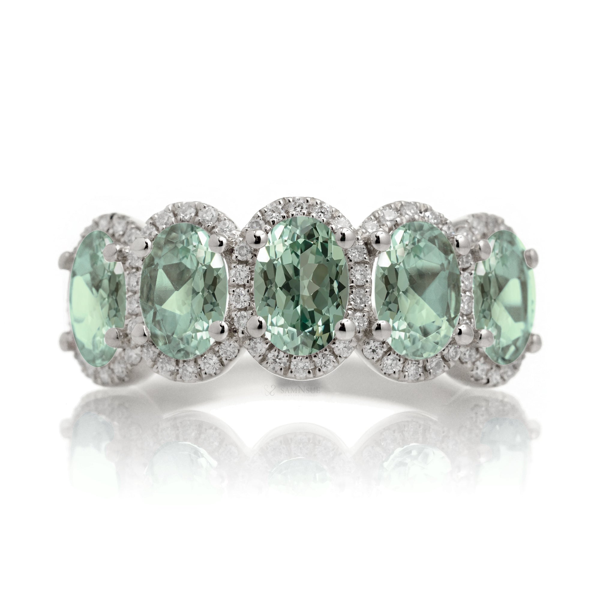 Five stone green sapphire wedding anniversary band with diamond halo in white gold