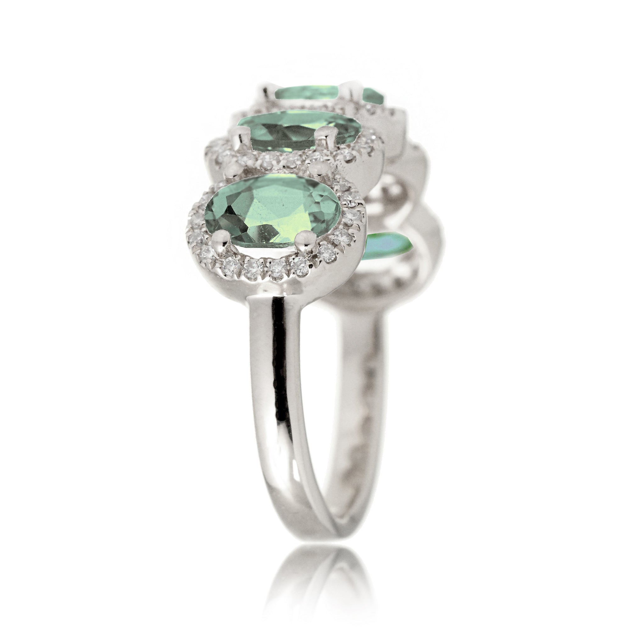 Five stone green sapphire wedding anniversary band with diamond halo in white gold