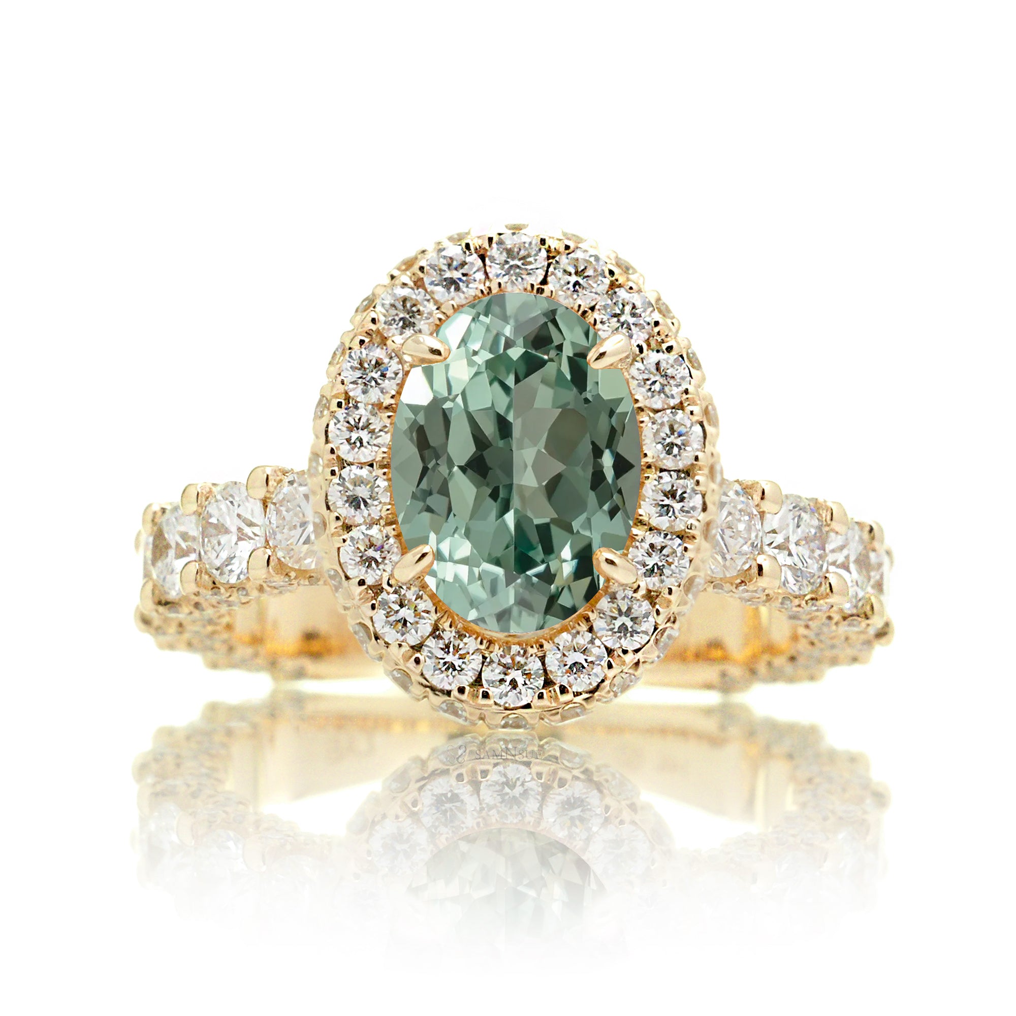 Oval green sapphire diamond engagement ring with halo