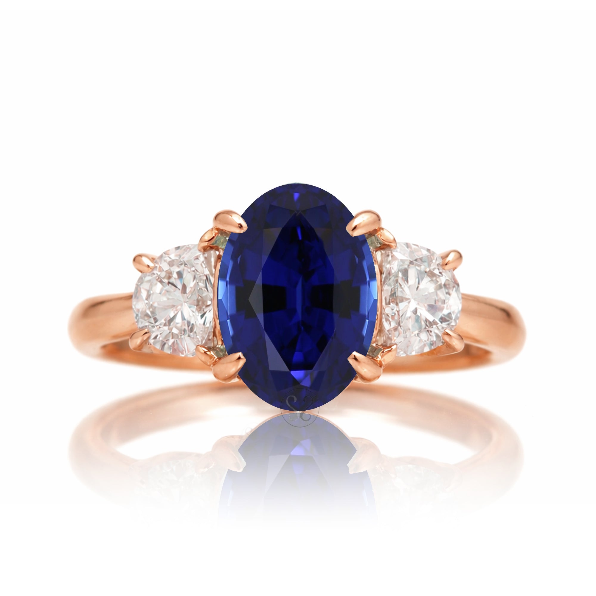 Oval blue sapphire half moon diamond three stone ring rose gold