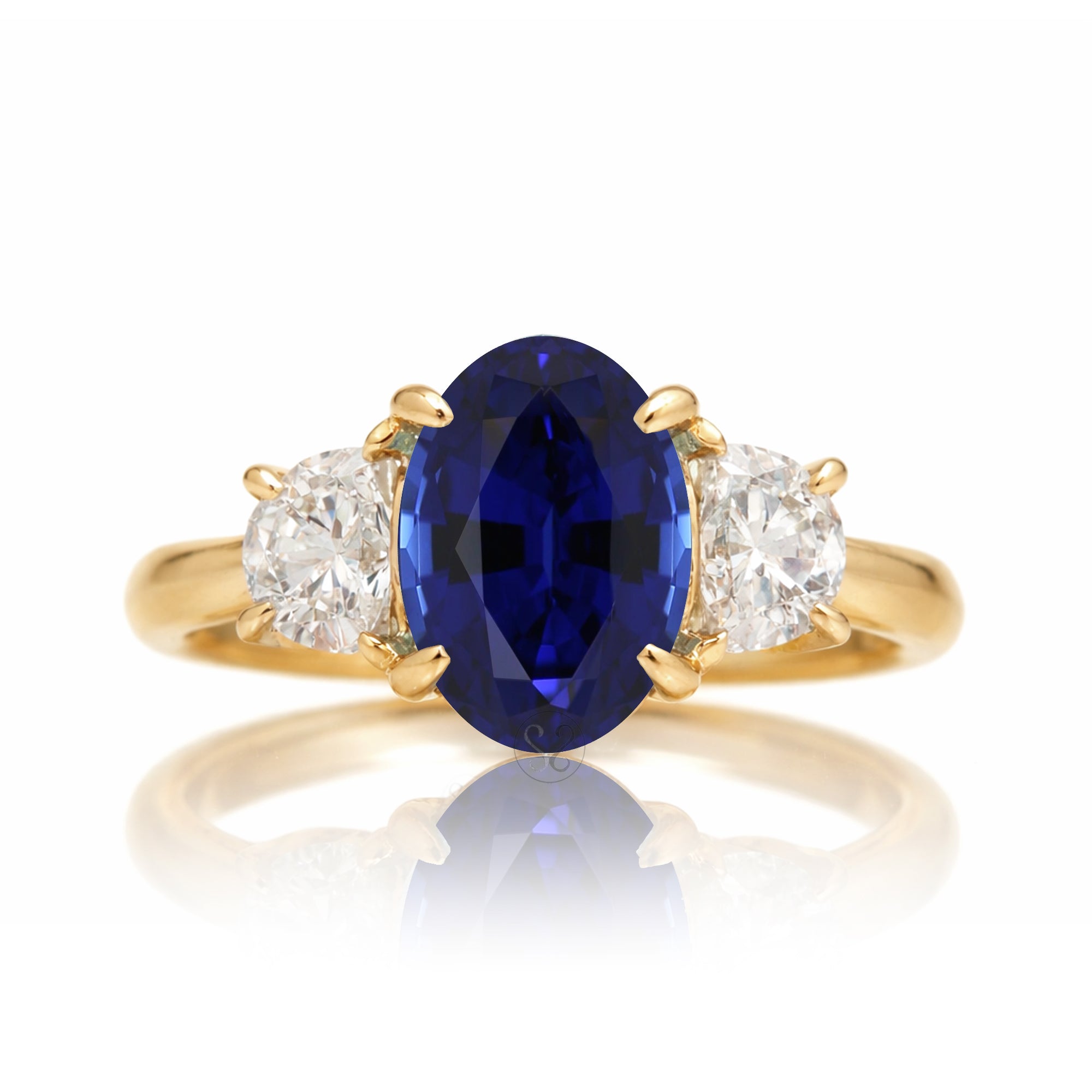 Oval blue sapphire half moon diamond three stone ring yellow gold