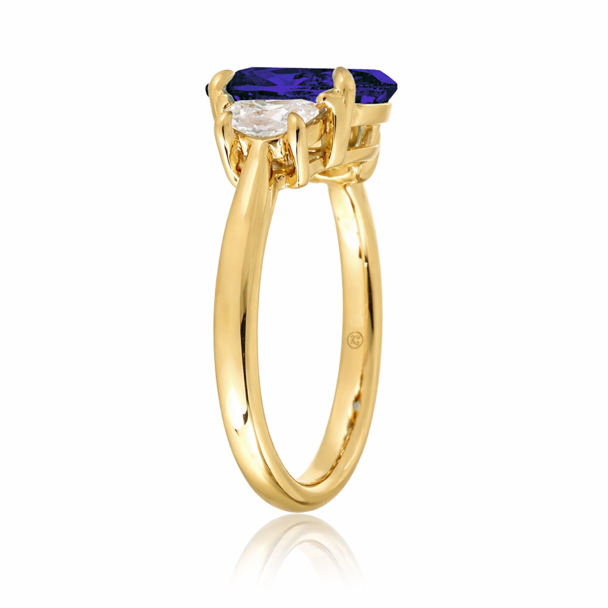 Oval blue sapphire half moon diamond three stone ring yellow gold