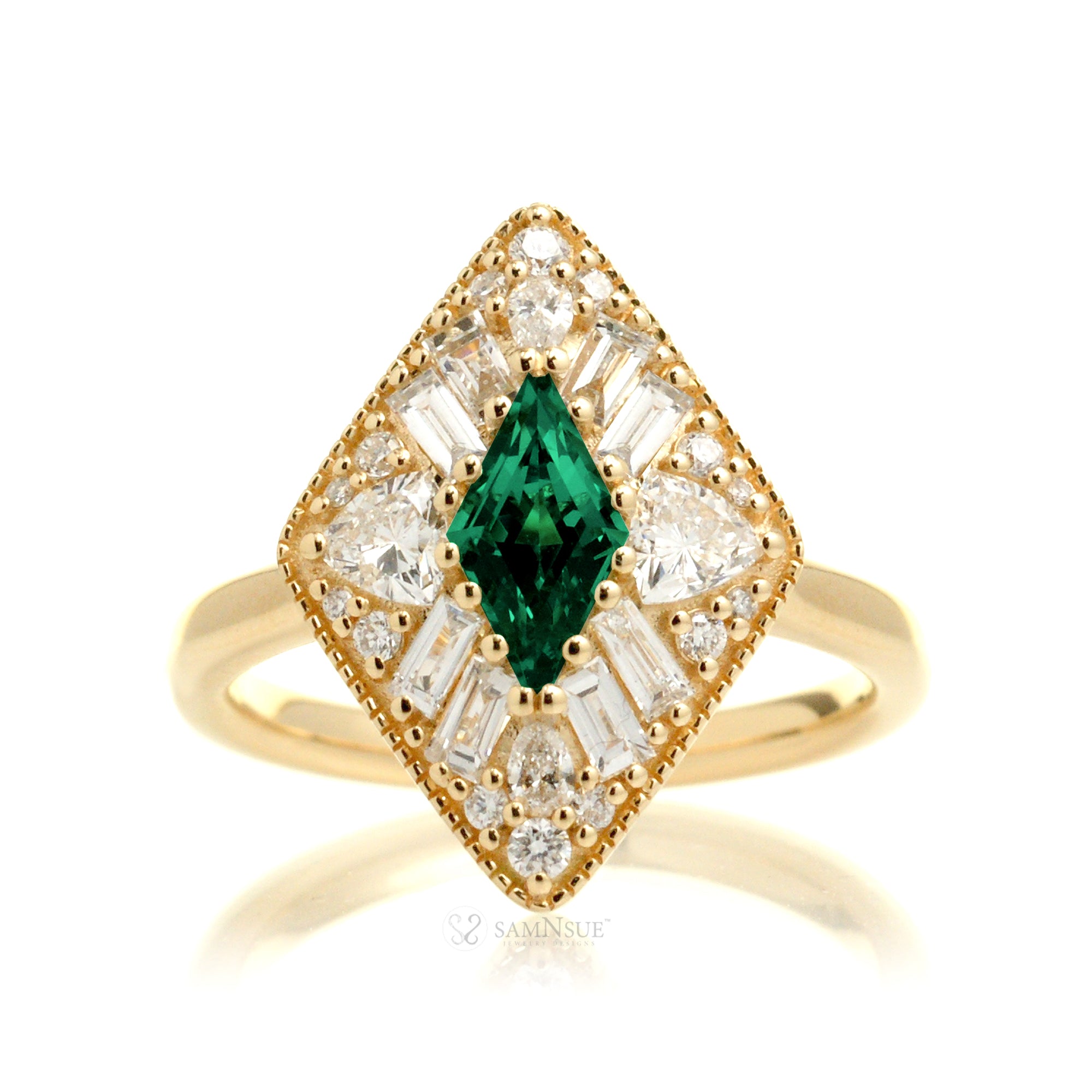 Kite cut green emerald and diamond vintage halo ring in yellow gold