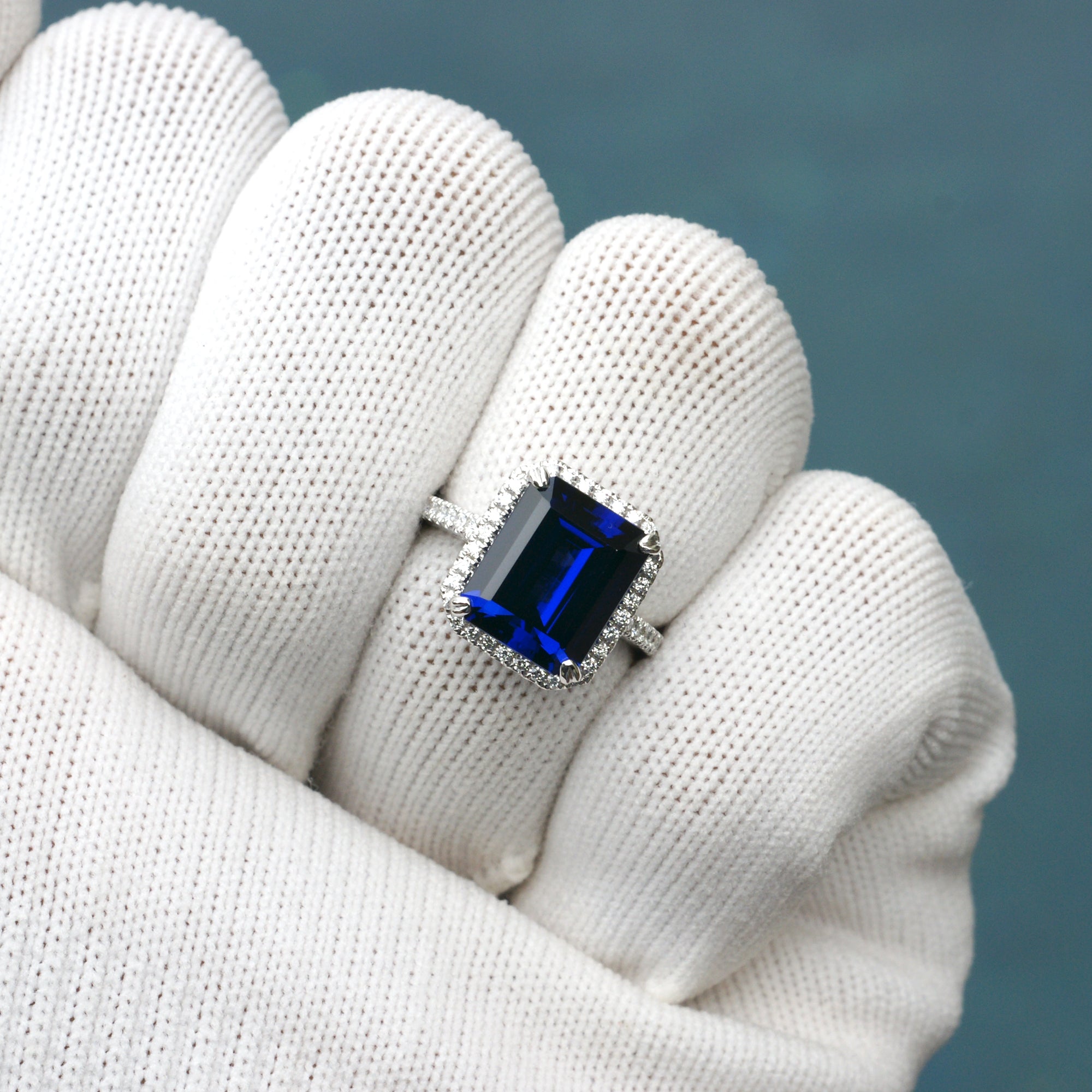 Blue sapphire emerald cut diamond halo and band wedding engagement ring set
