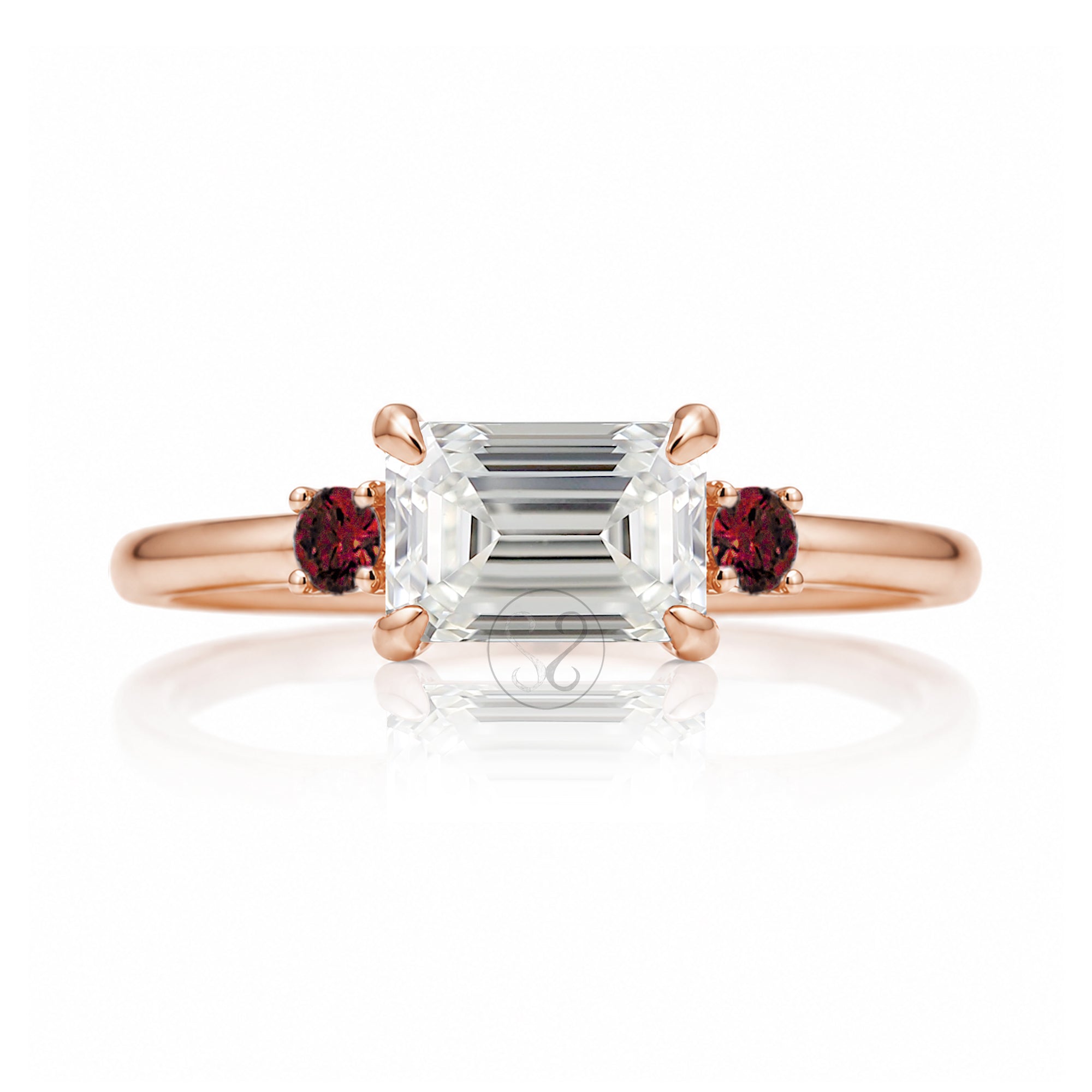 east-west emerald cut diamond three stone ring the Lena with side red rubies rose gold