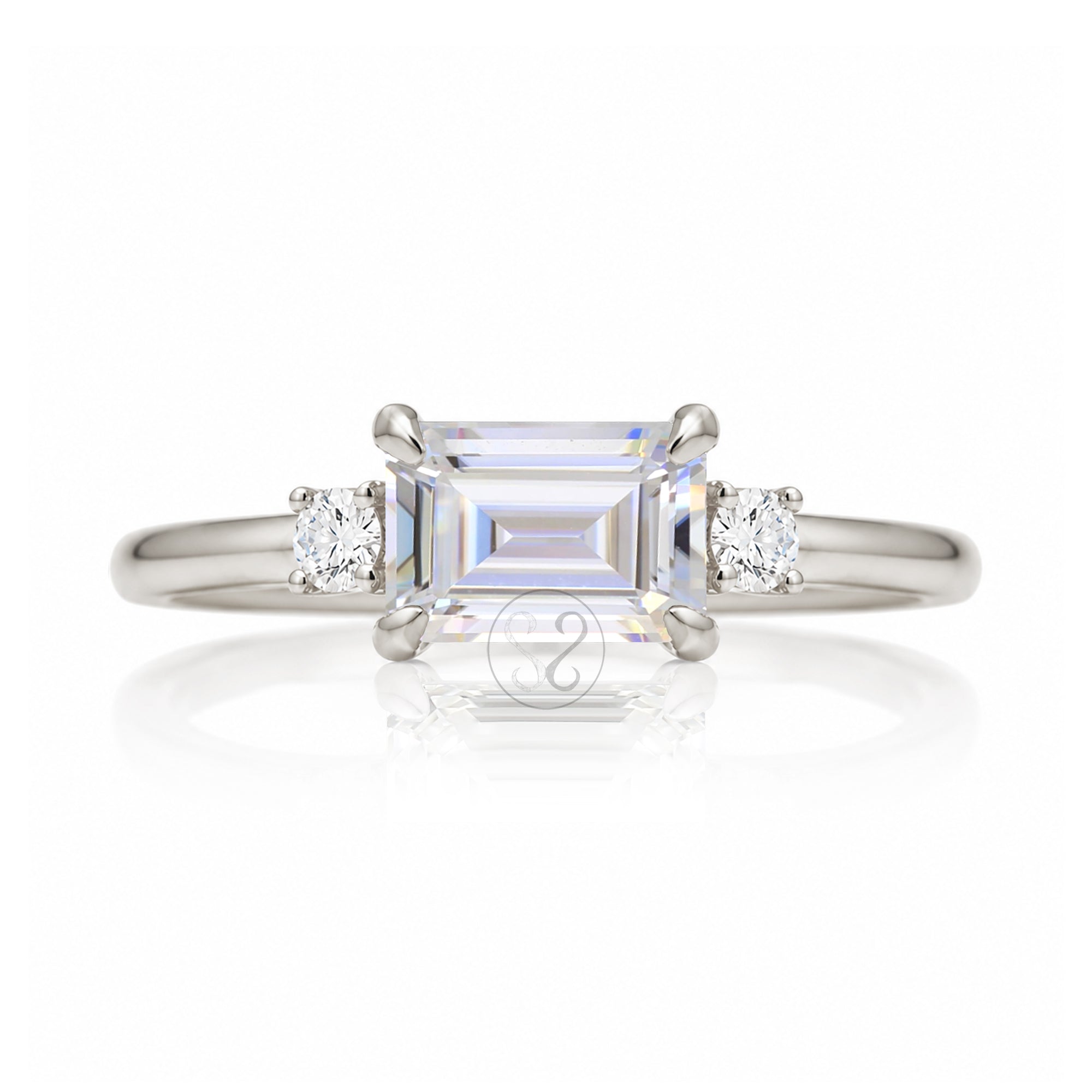 Emerald step cut moissanite three stone east-west ring the Lena white gold