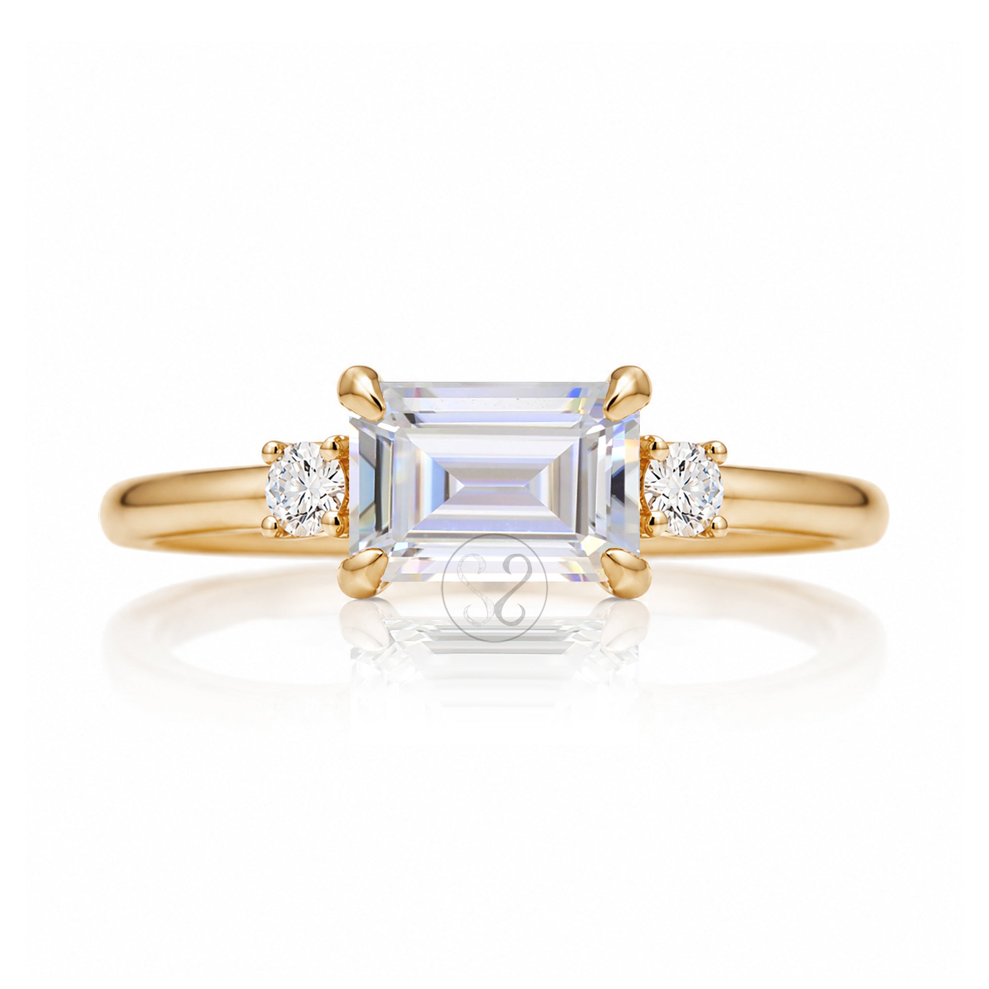 Emerald step cut moissanite three stone east-west ring the Lena yellow gold