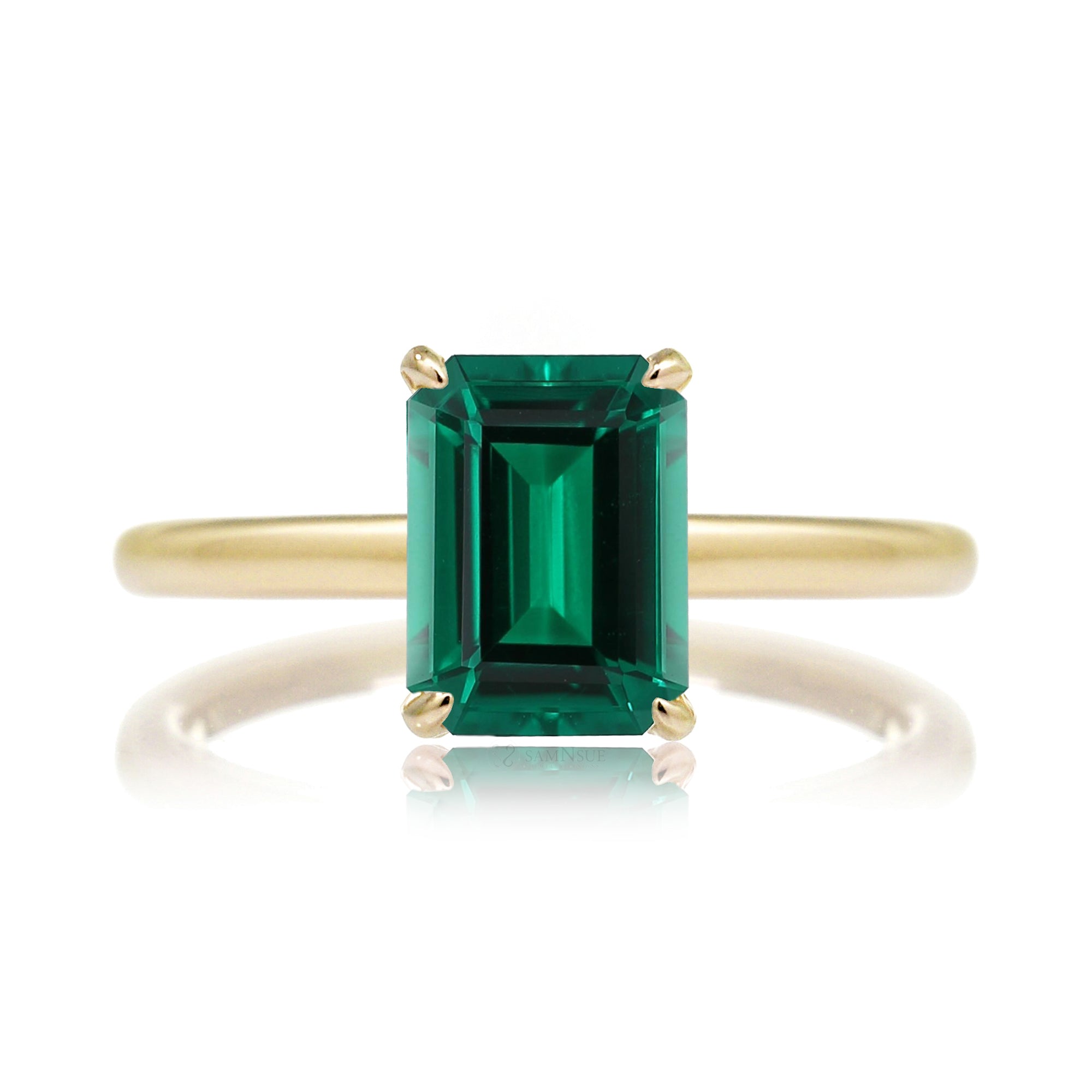 Emerald step cut green emerald ring with diamond hidden halo on yellow gold
