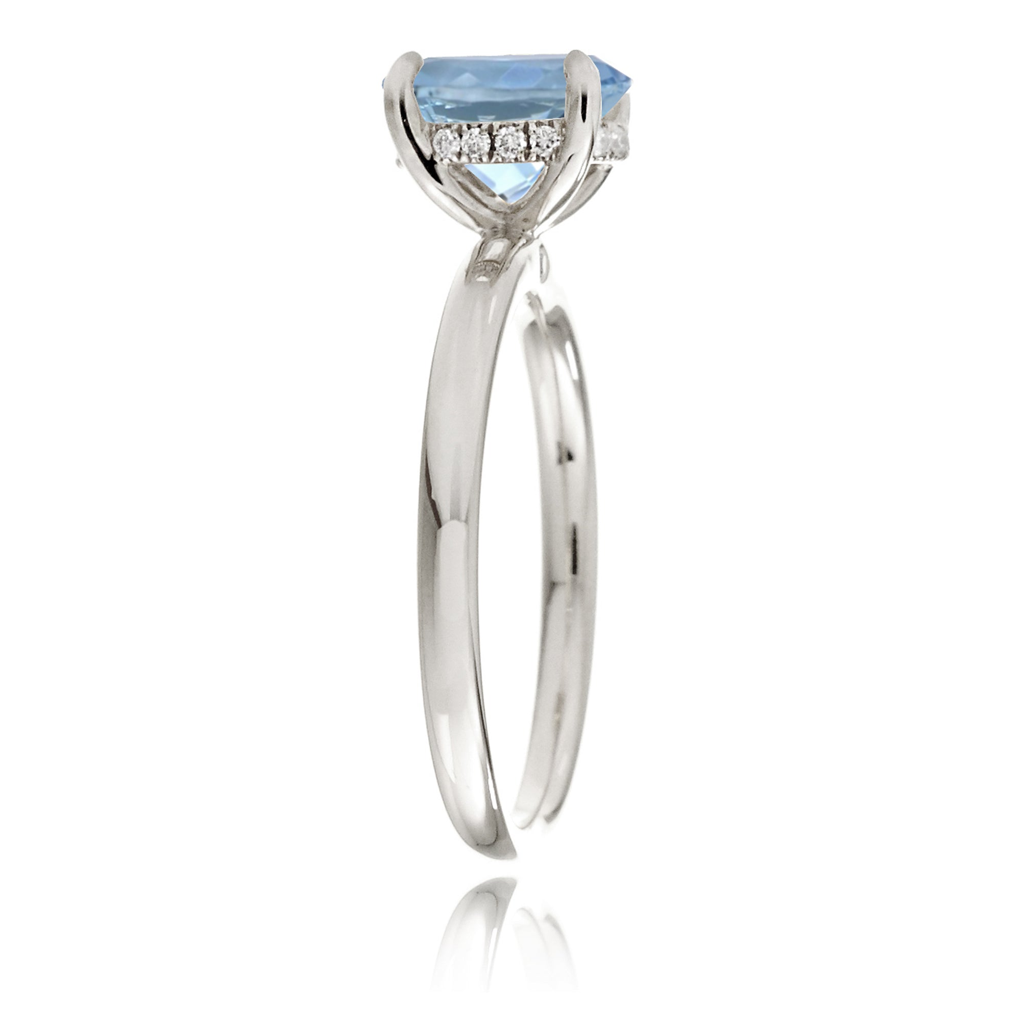 Oval aquamarine ring with diamond hidden halo and rounded band white gold