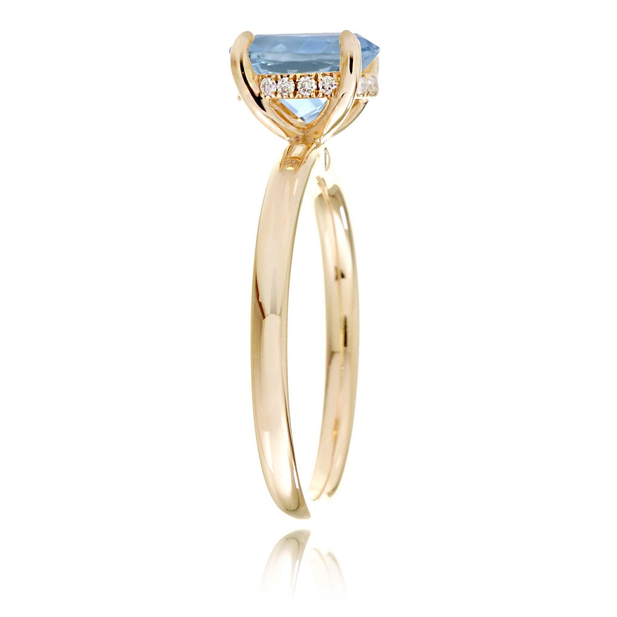 Oval aquamarine ring with diamond hidden halo and rounded band yellow gold