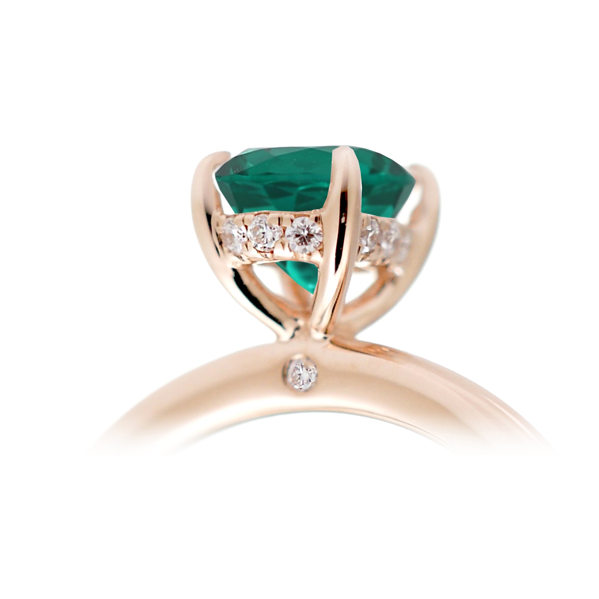 Oval cut green emerald ring with diamond hidden halo on rose gold