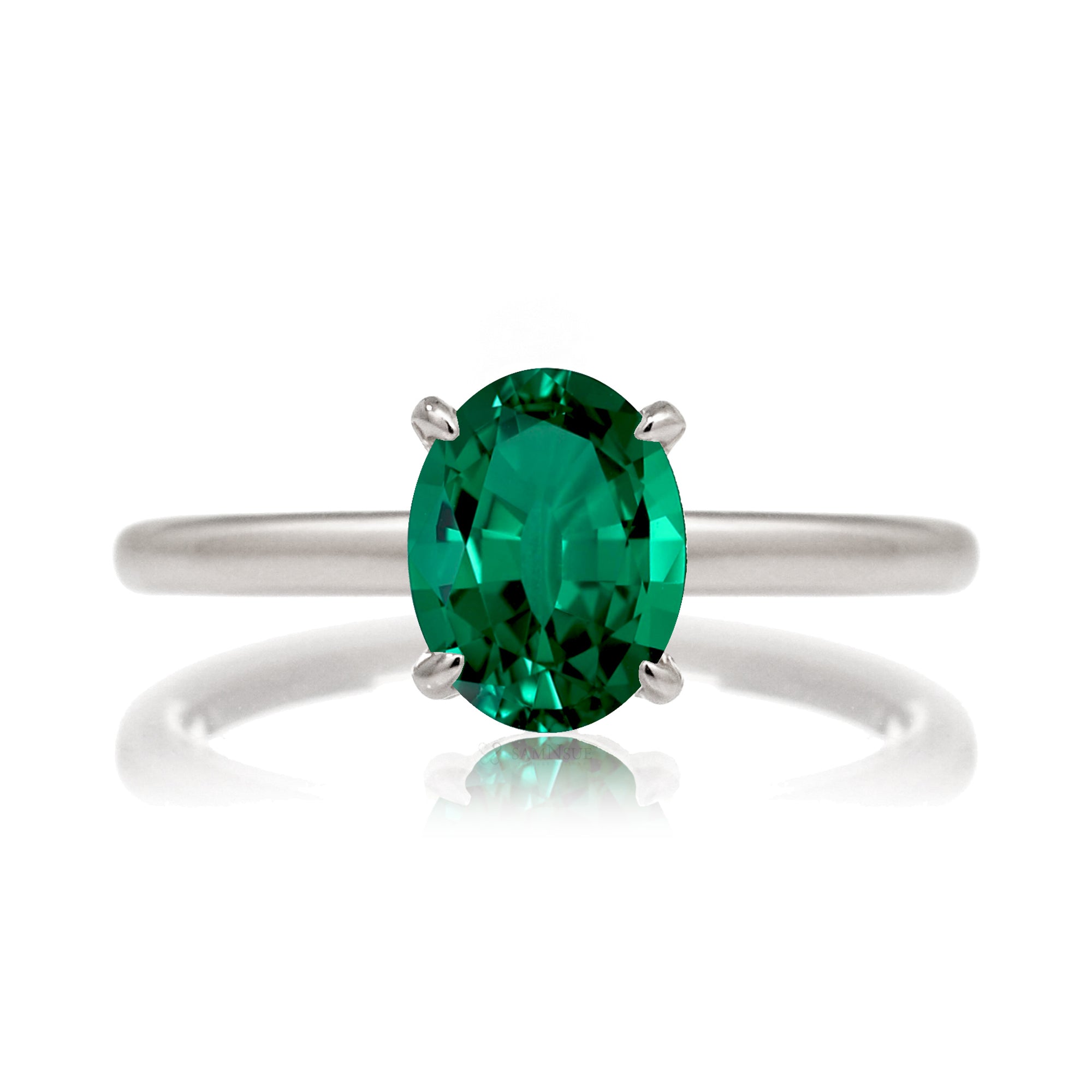 Oval cut green emerald ring with diamond hidden halo on white gold