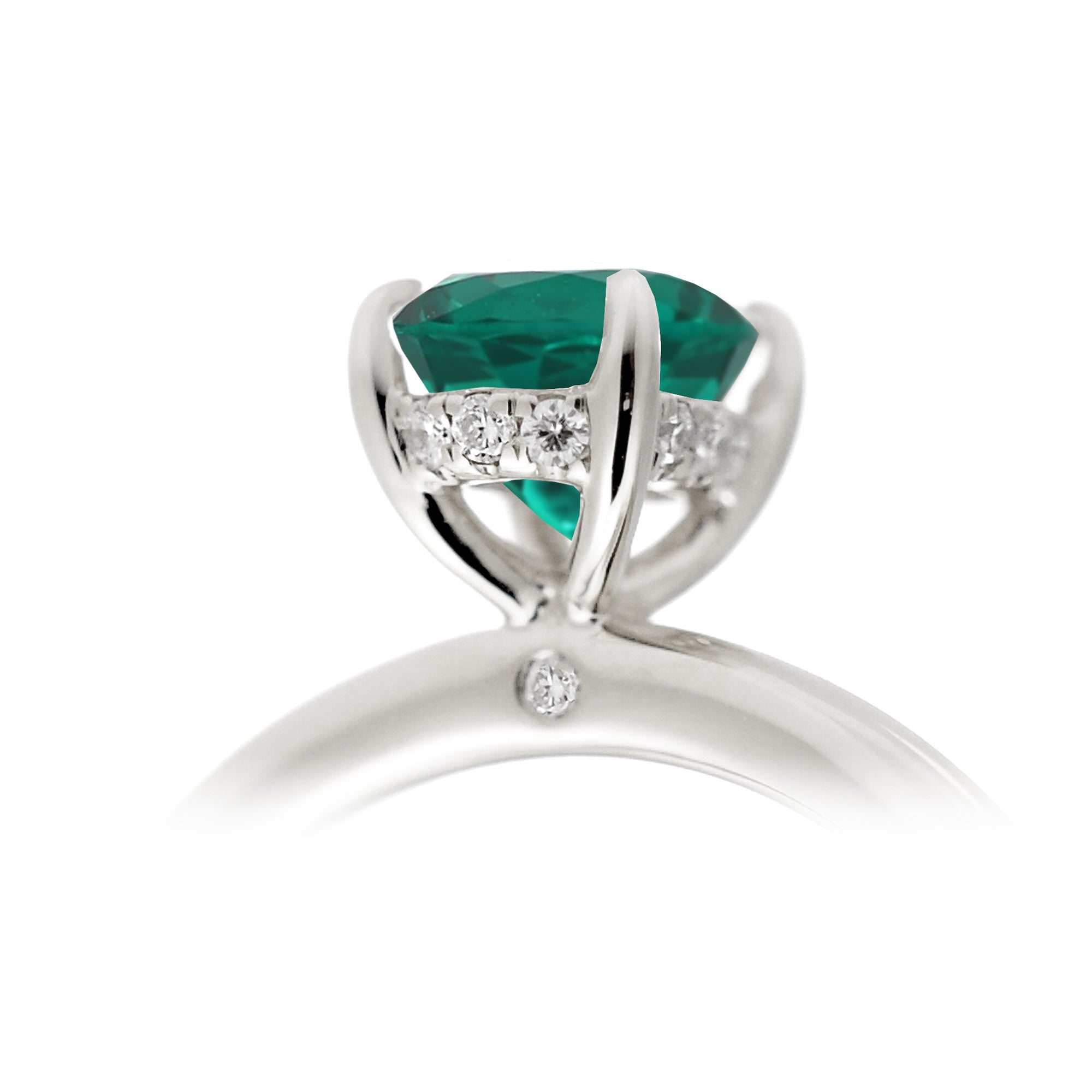 Oval cut green emerald ring with diamond hidden halo on white gold