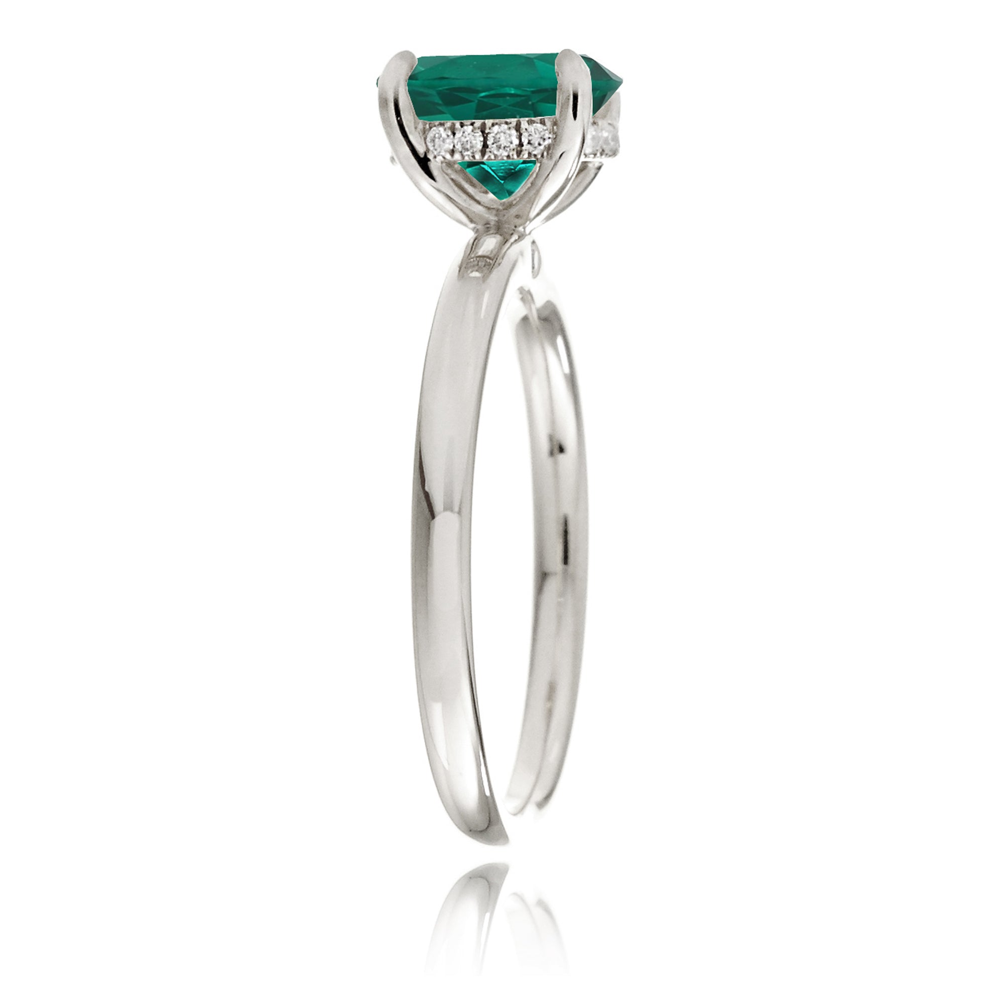 Oval cut green emerald ring with diamond hidden halo on white gold