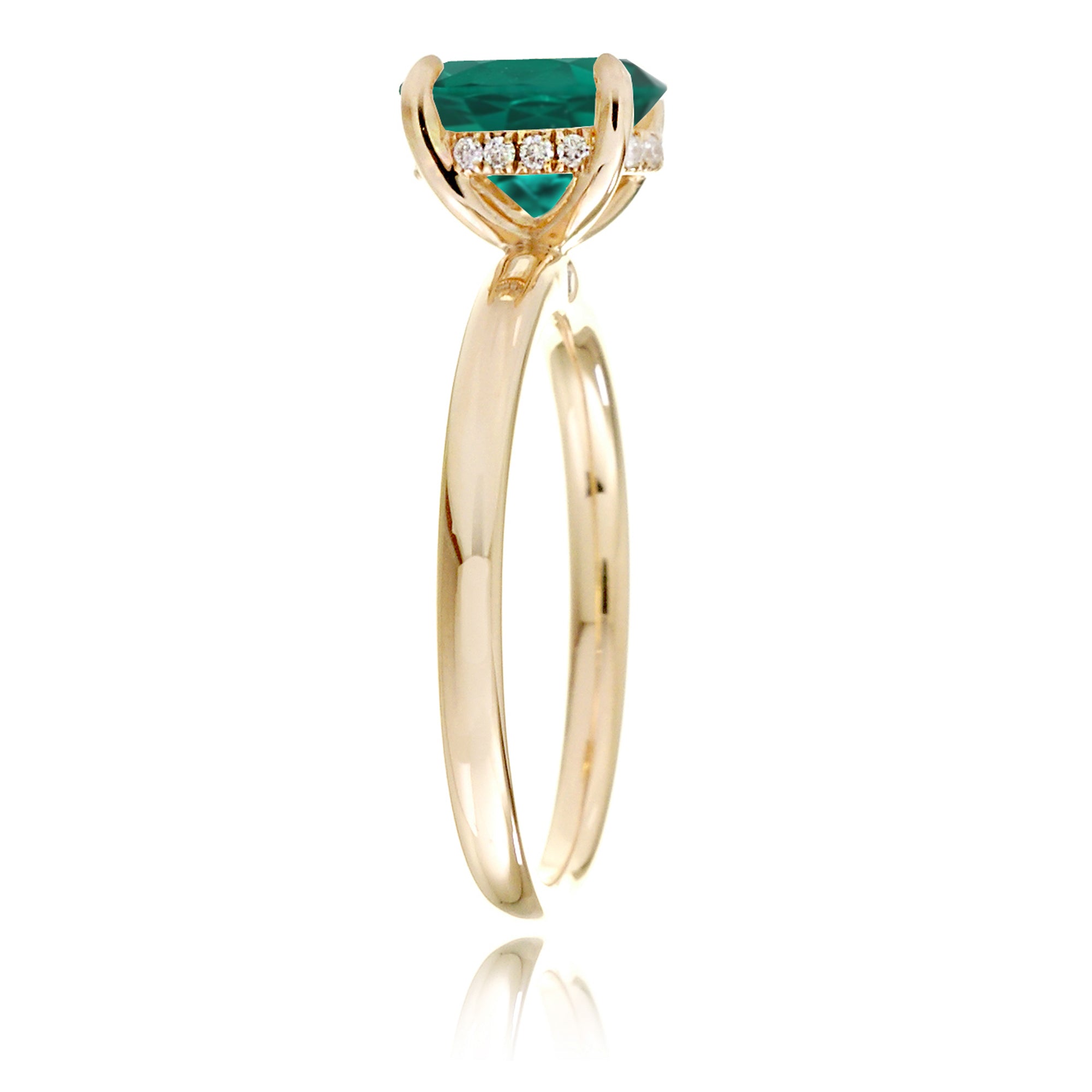 Oval cut green emerald ring with diamond hidden halo on yellow gold