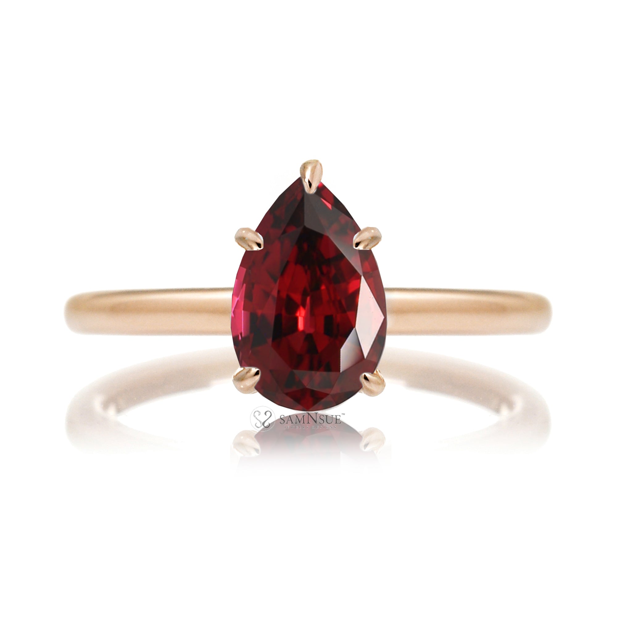 Pear ruby solitaire engagement ring in rose gold with hidden halo