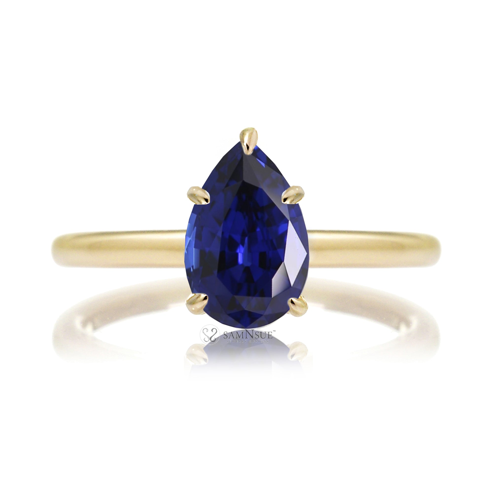 Pear blue sapphire solitaire engagement ring in yellow gold with hidden halo