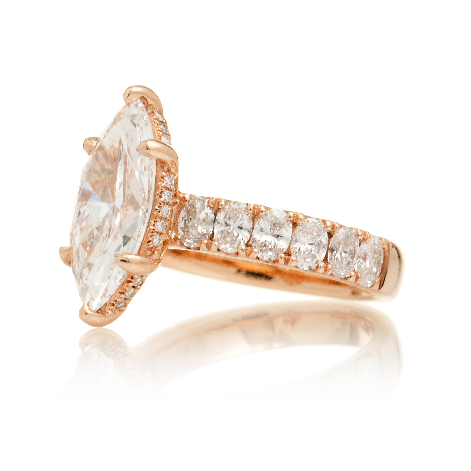 Large marquise cut diamond ring with wide oval diamond band and hidden diamond halo rose gold