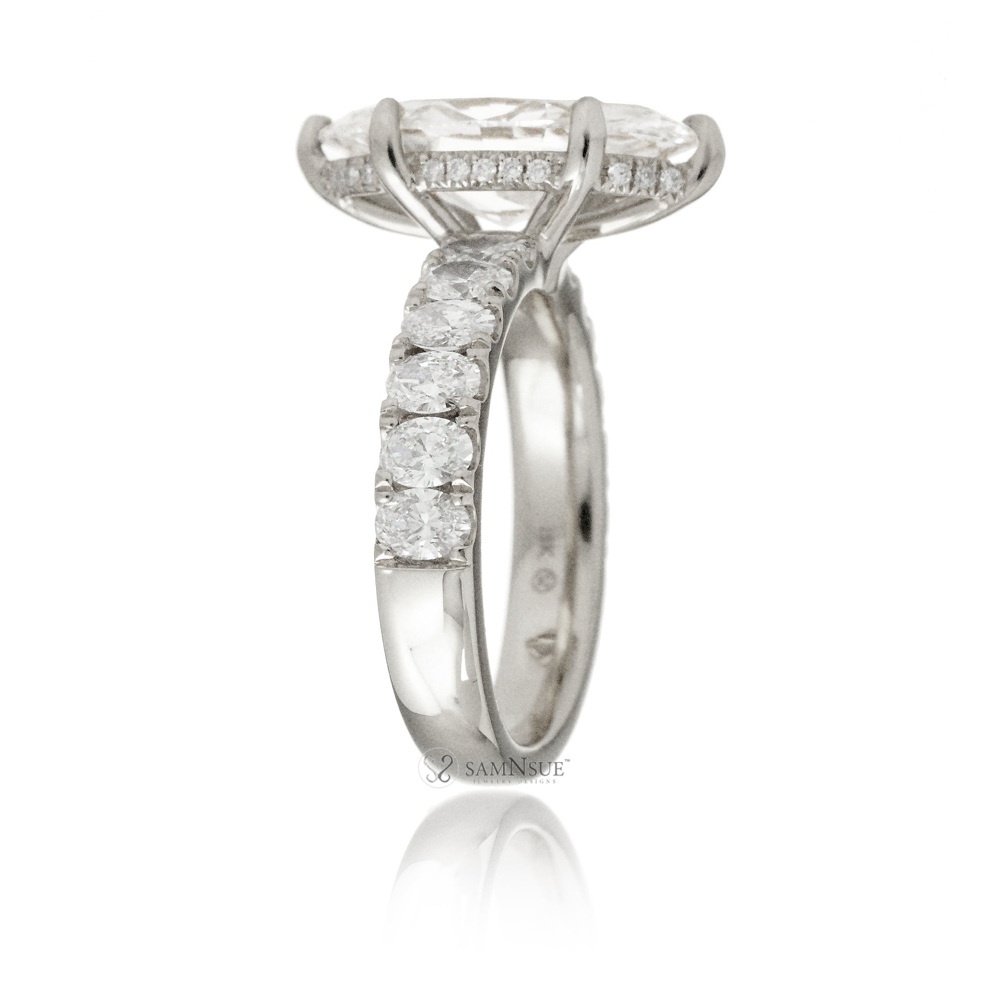 Large marquise cut diamond ring with wide oval diamond band and hidden diamond halo white gold