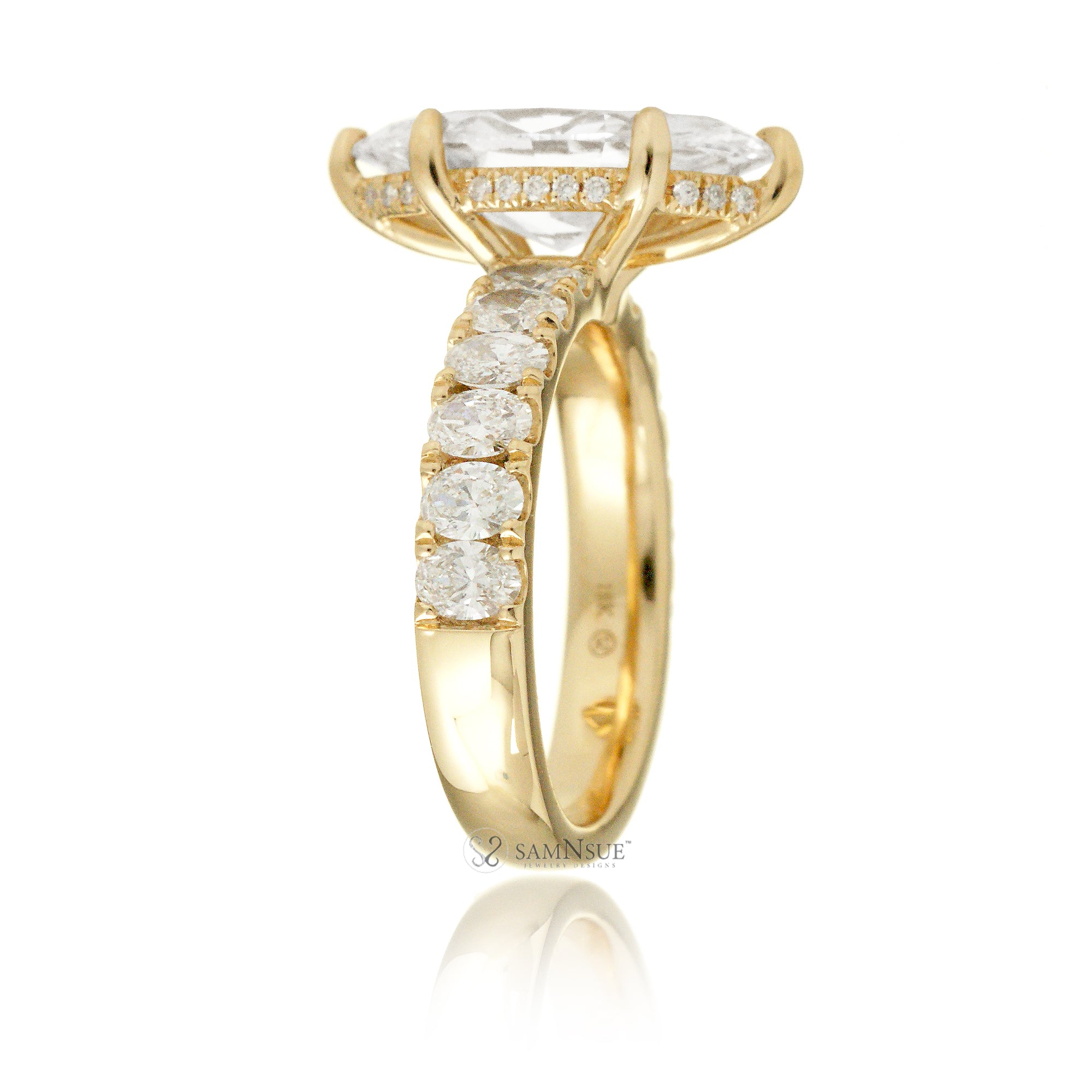 Large marquise cut diamond ring with wide oval diamond band and hidden diamond halo yellow gold