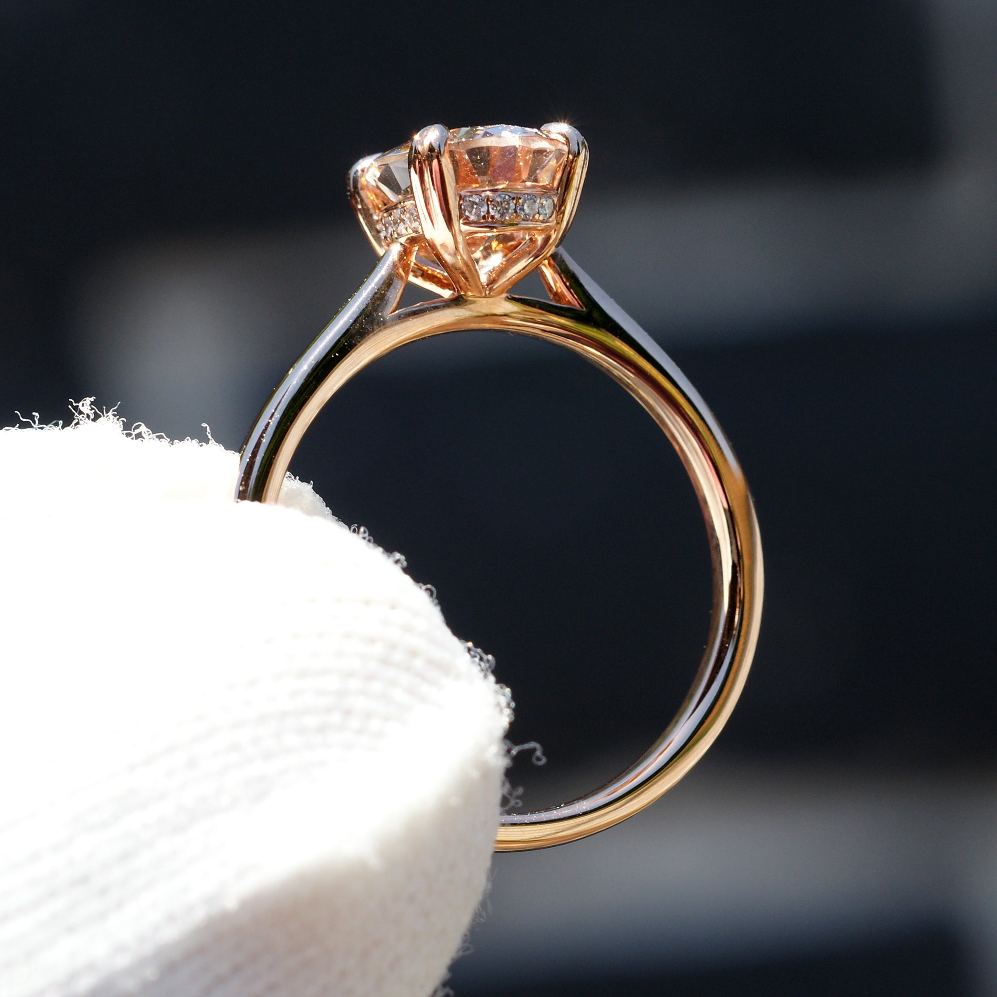Oval morganite solitaire engagement ring with hidden diamond halo in rose gold