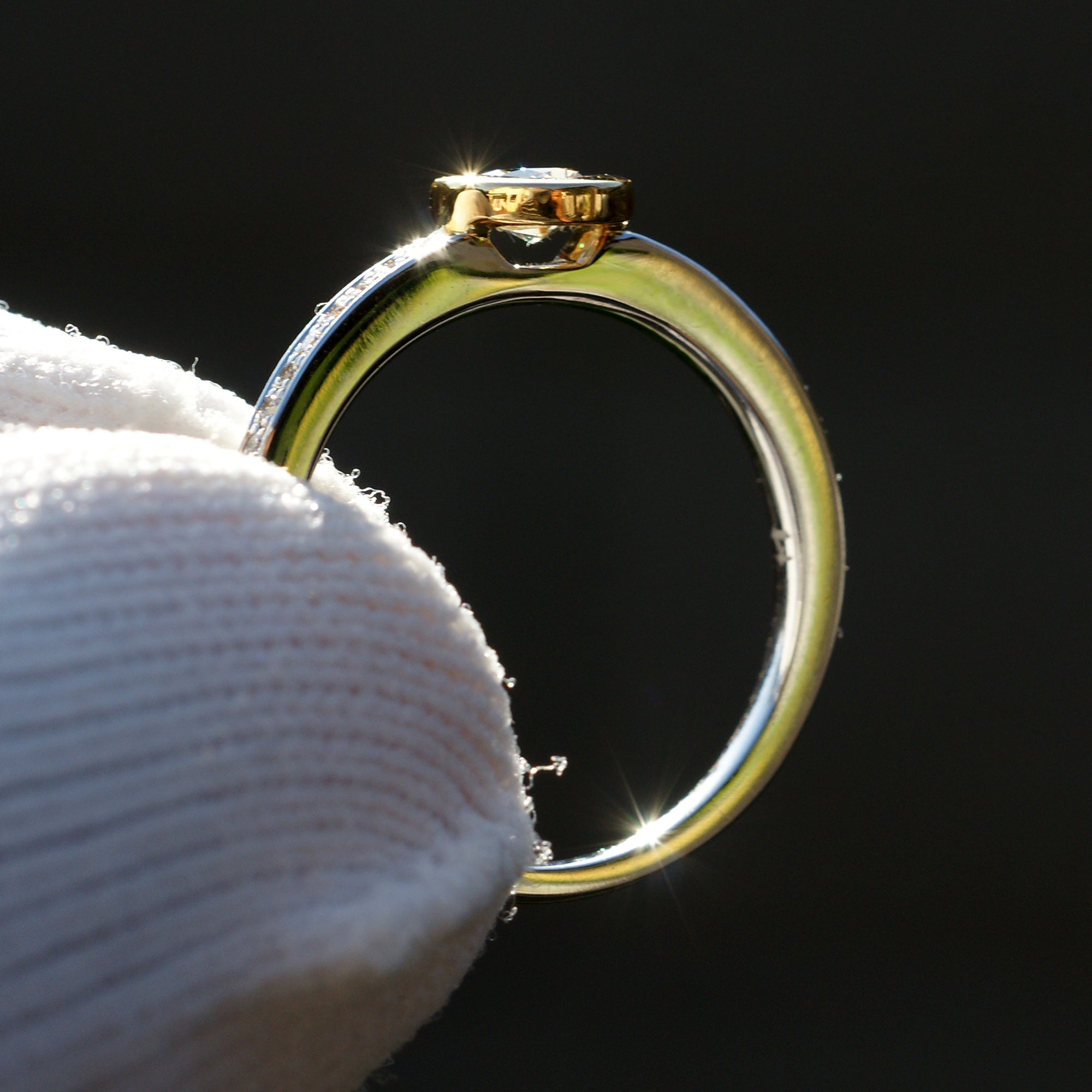 Fancy yellow diamond solitaire bezel engagement ring