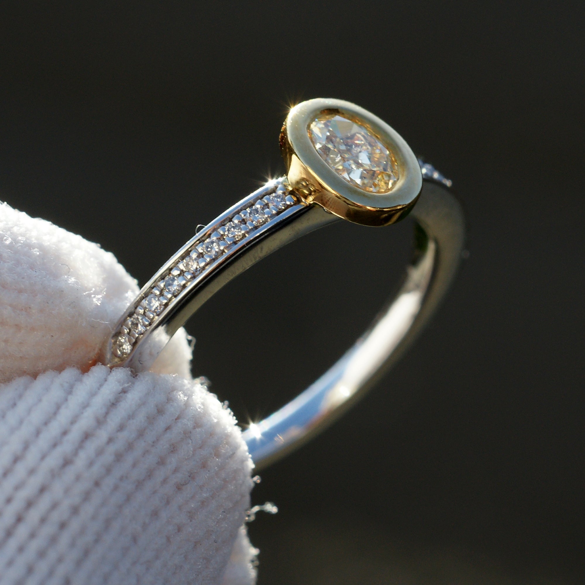 Fancy yellow diamond solitaire bezel engagement ring