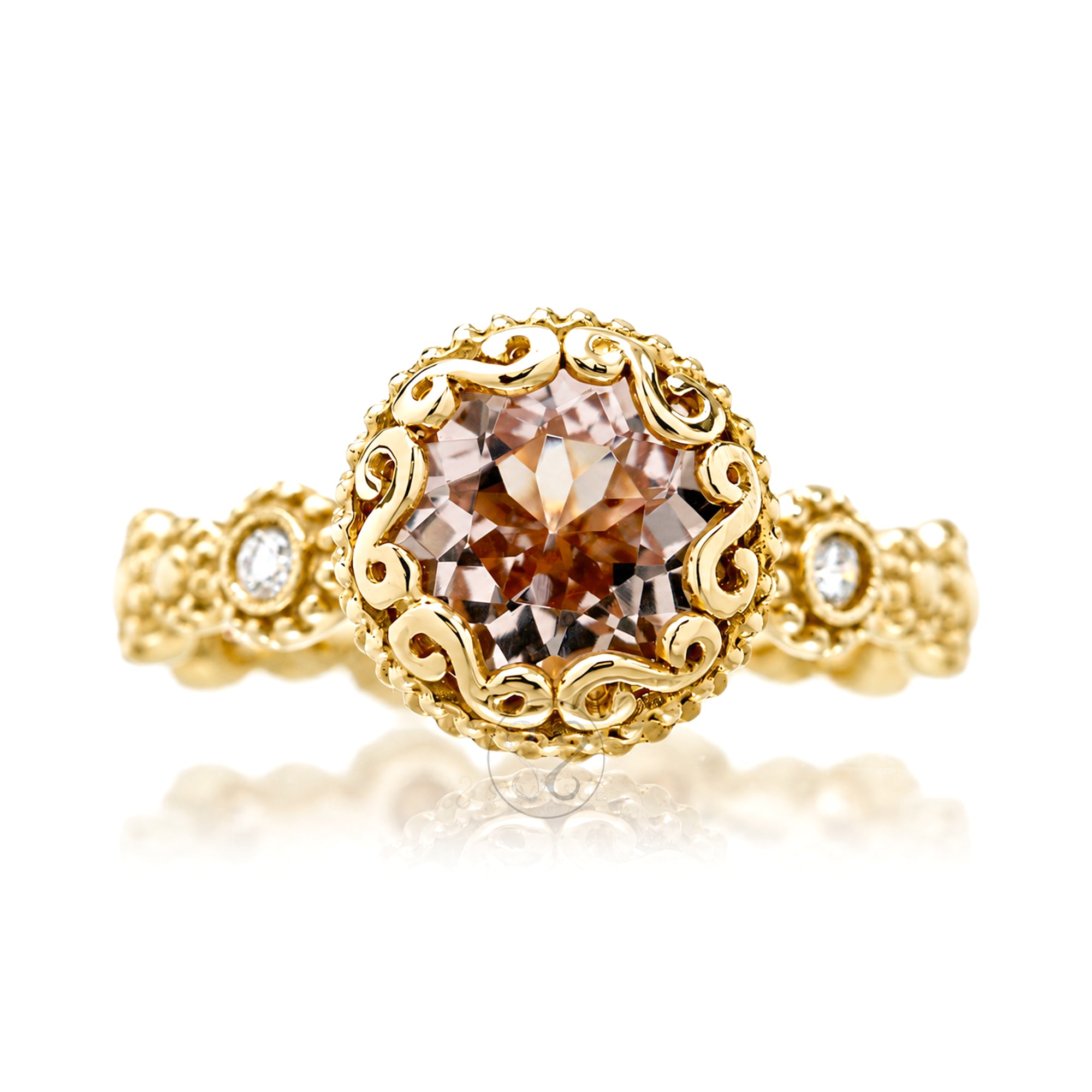 An ornate rose gold ring featuring a large round-cut brown gemstone in a detailed filigree setting, with small accent diamonds on the shoulders, incased bezel style center stone yellow gold