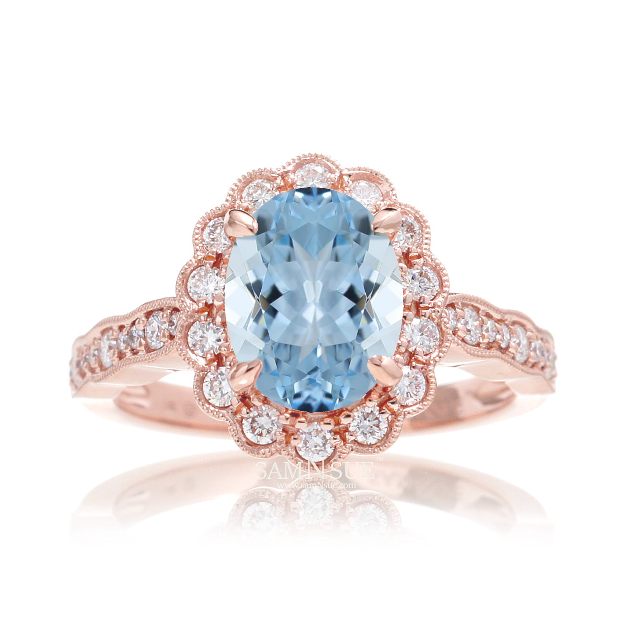 Oval aquamarine ring with diamond scallop halo and vintage diamond band in rose gold