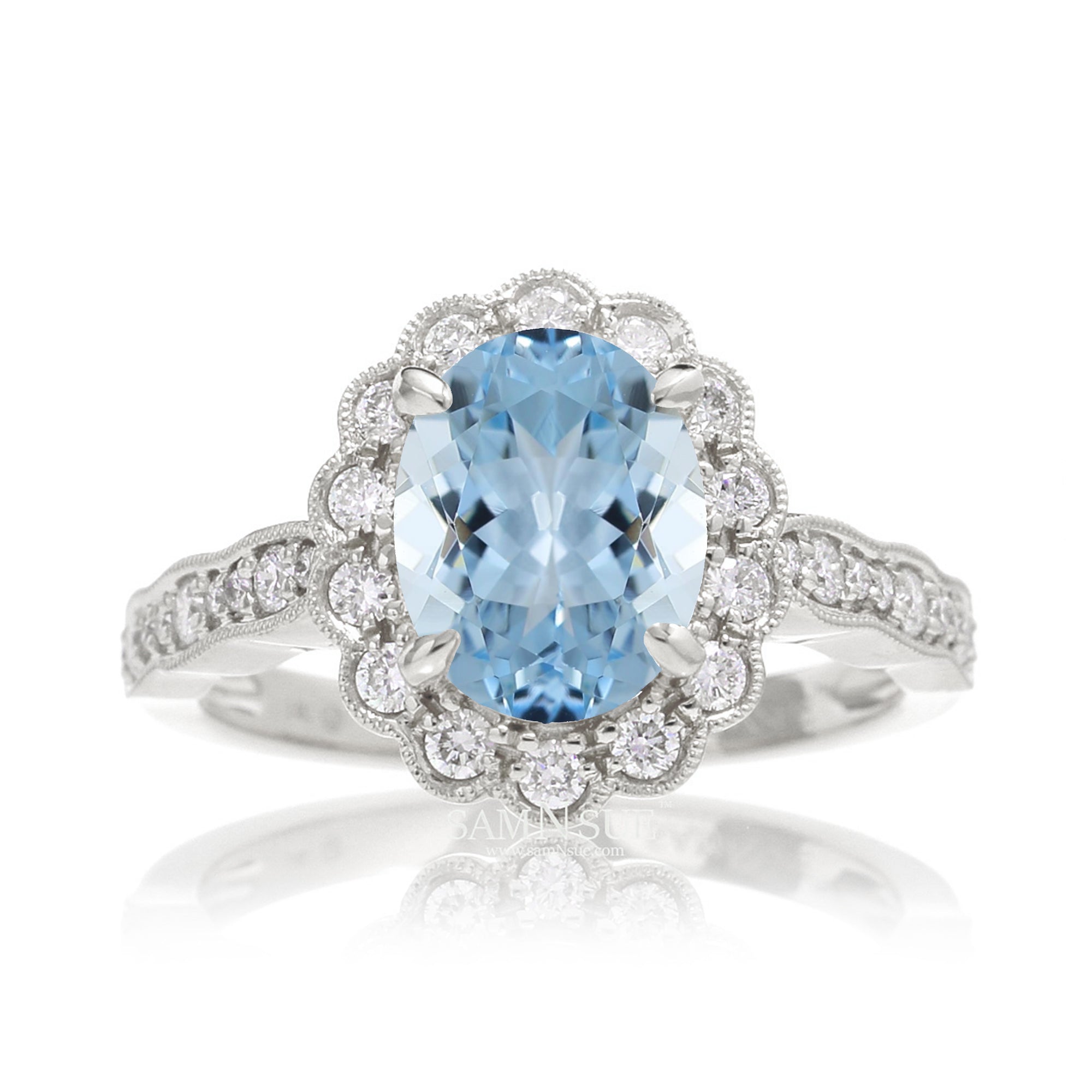 Oval aquamarine ring with diamond scallop halo and vintage diamond band in white gold