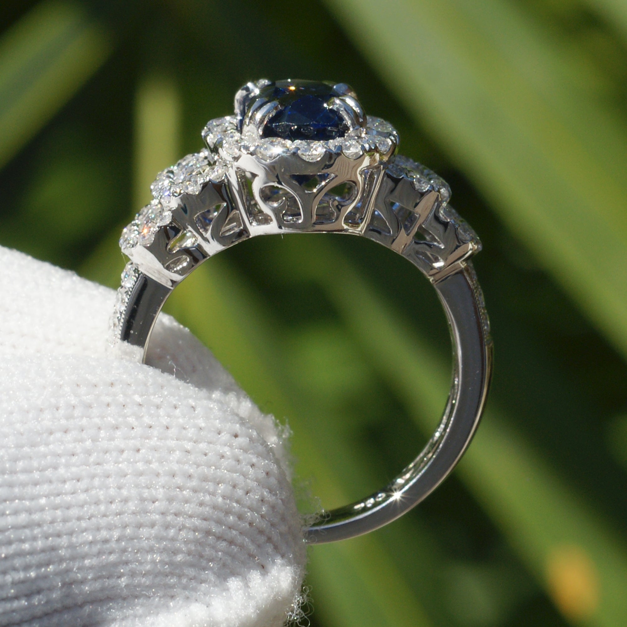 Natural sapphire and diamond ring with halo and wide band in white gold