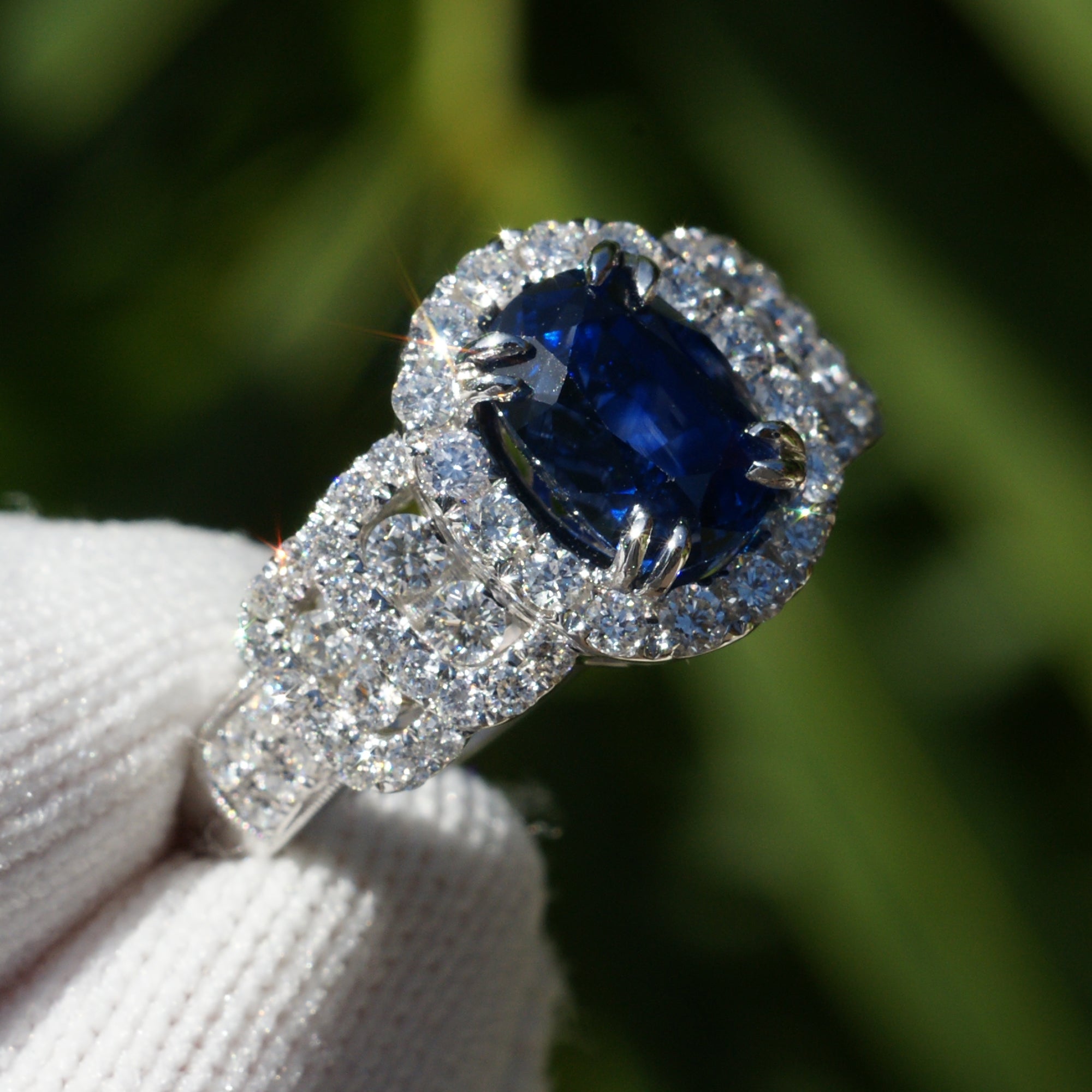 Natural sapphire and diamond ring with halo and wide band in white gold