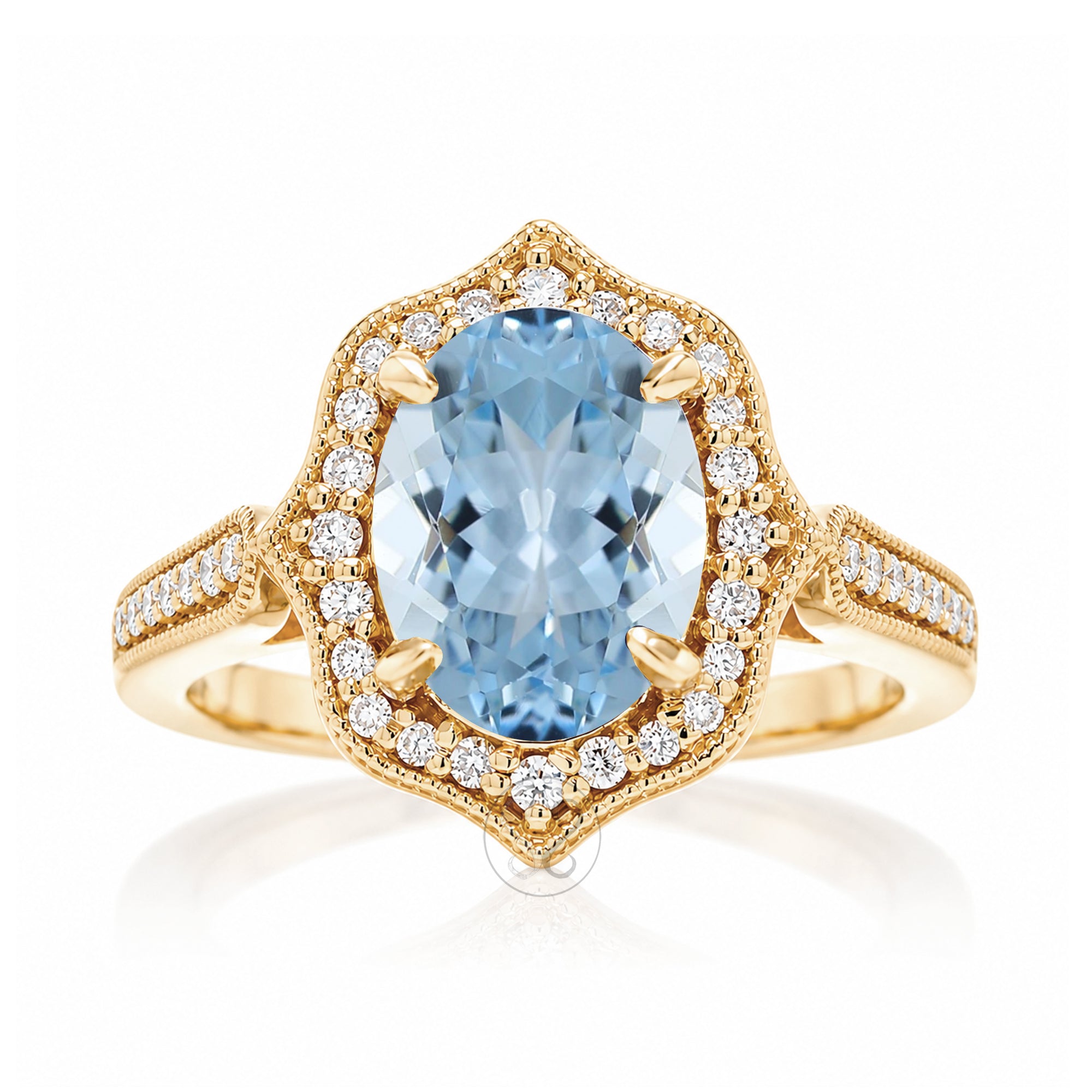 Vintage Oval Aquamarine and Diamond Halo Ring in Yellow Gold
