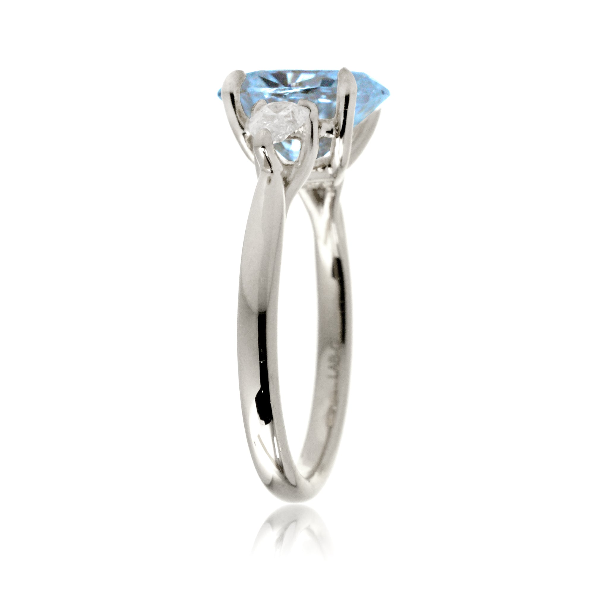 Oval aquamarine proposal ring with pear side diamonds white gold