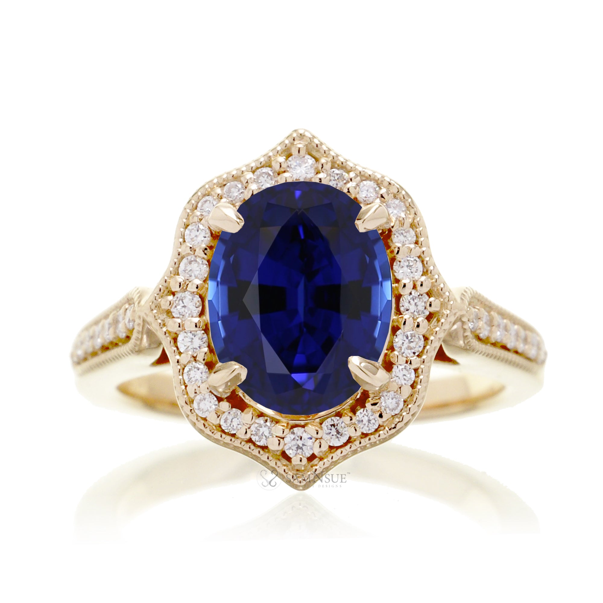 Vintage Oval Blue Sapphire and Diamond Halo Ring in Yellow Gold