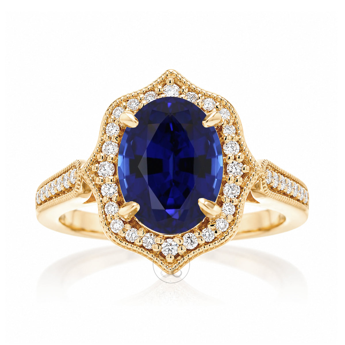 Vintage Oval Blue Sapphire and Diamond Halo Ring in Yellow Gold