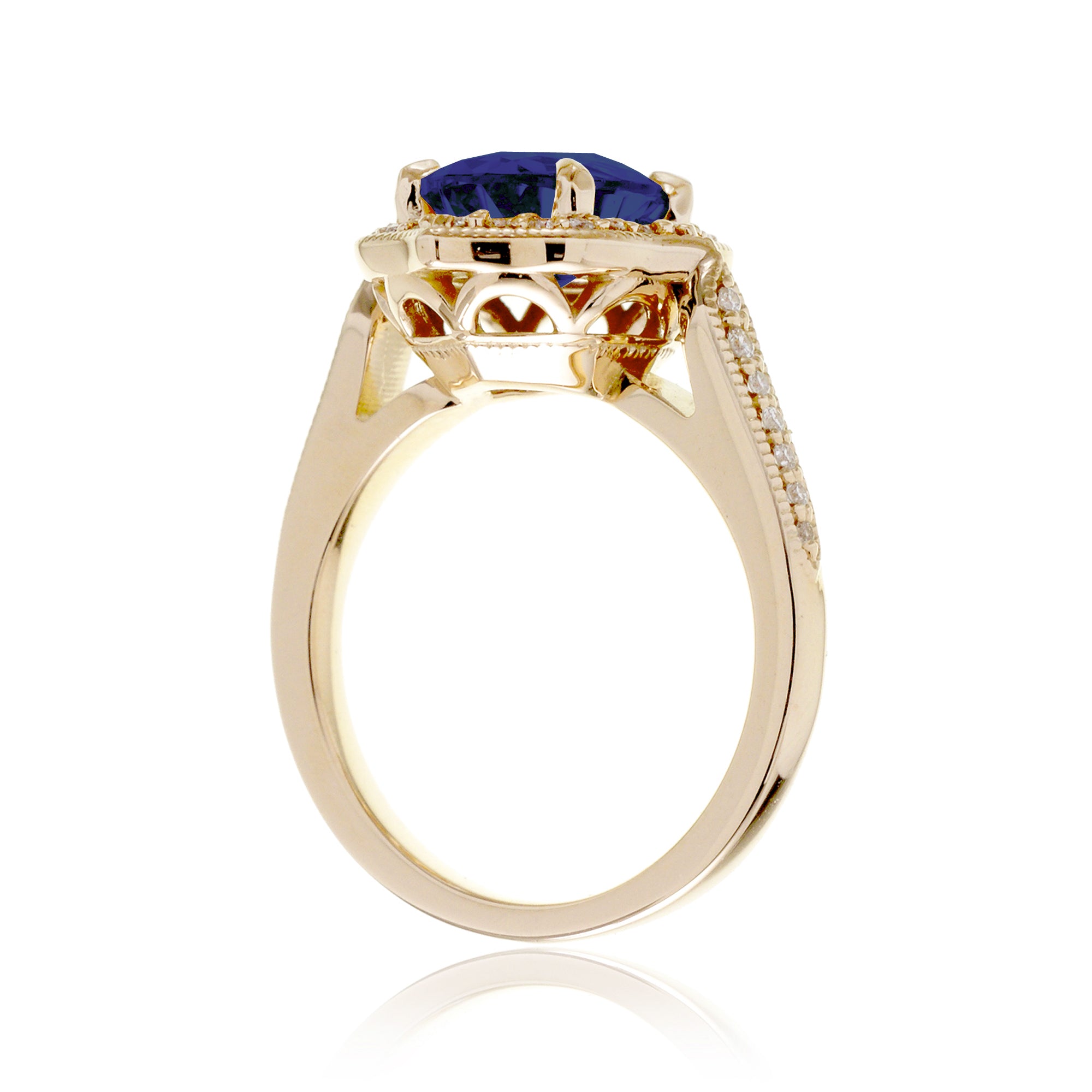 Vintage Oval Blue Sapphire and Diamond Halo Ring in Yellow Gold