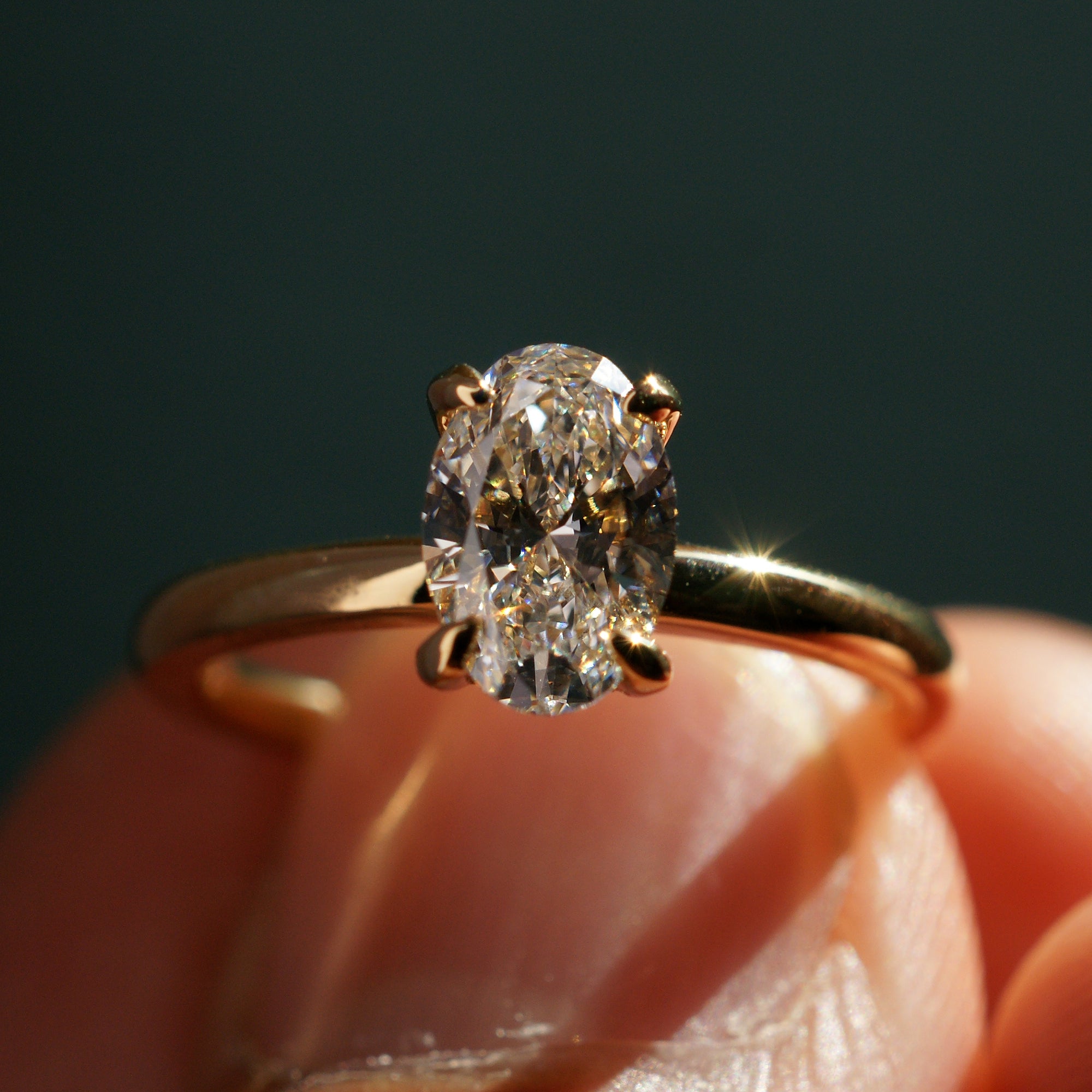 Front view of 1.04ct oval lab-grown diamond engagement ring in 18k yellow gold with high-polish solid band