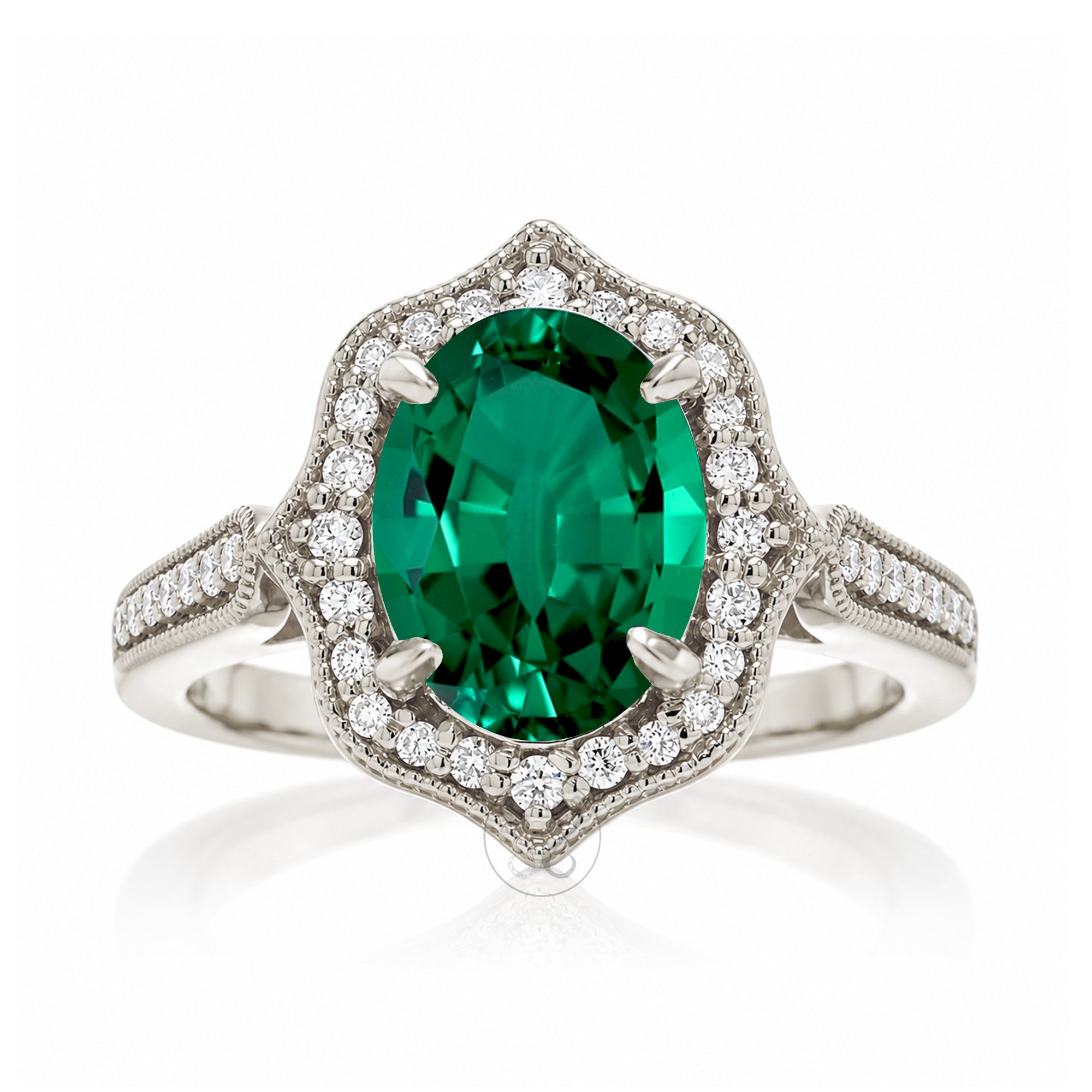 Elegant Oval Emerald and Diamond Ring in White Gold Platinum