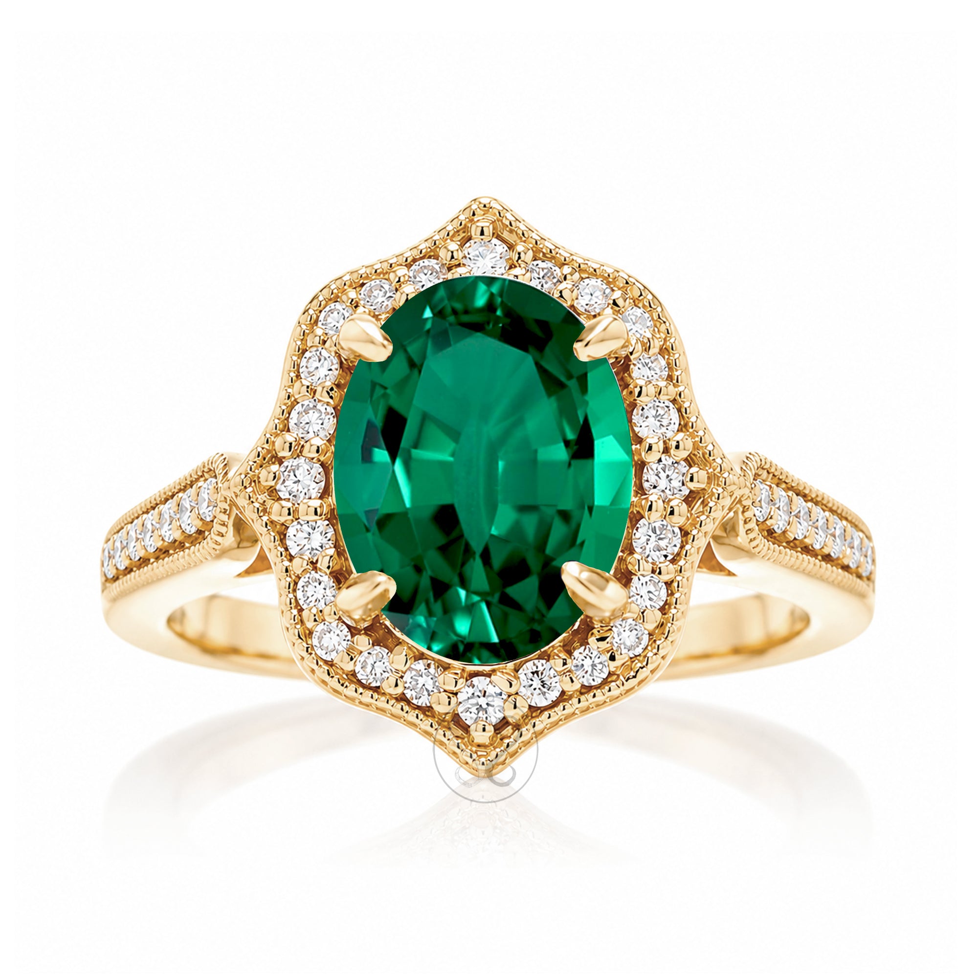 Vintage Oval Emerald and Diamond Halo Ring in Yellow Gold